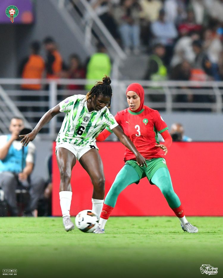 Nigeria’s Super Falcons star Esther Okoronkwo against a Moroccan player 