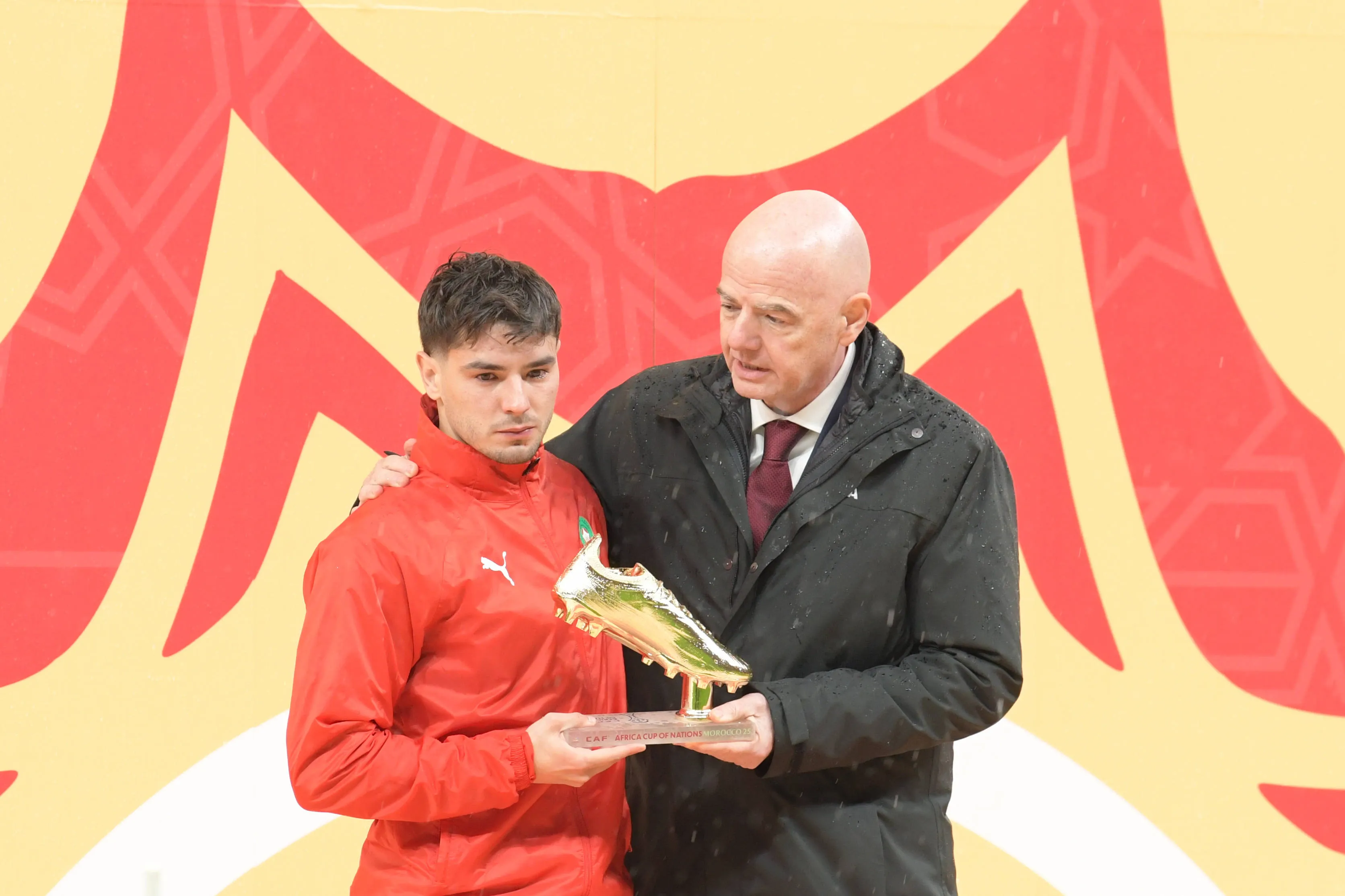 Morocco's Brahim Diaz receives the Golden Boot from FIFA President Gianni Infantino