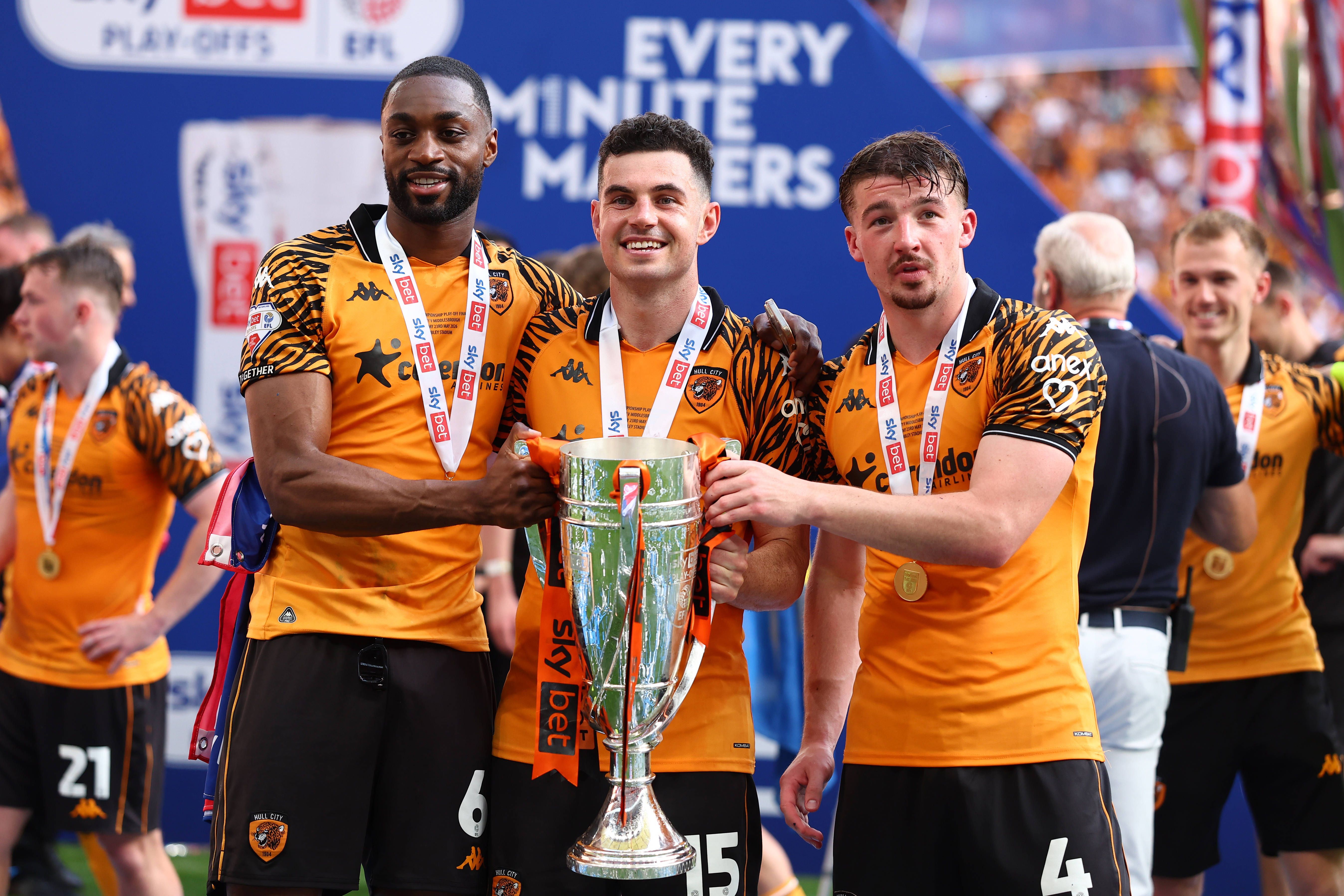 Semi Ajayi, John Egan, and Charlie Hughes of Hull City celebrate