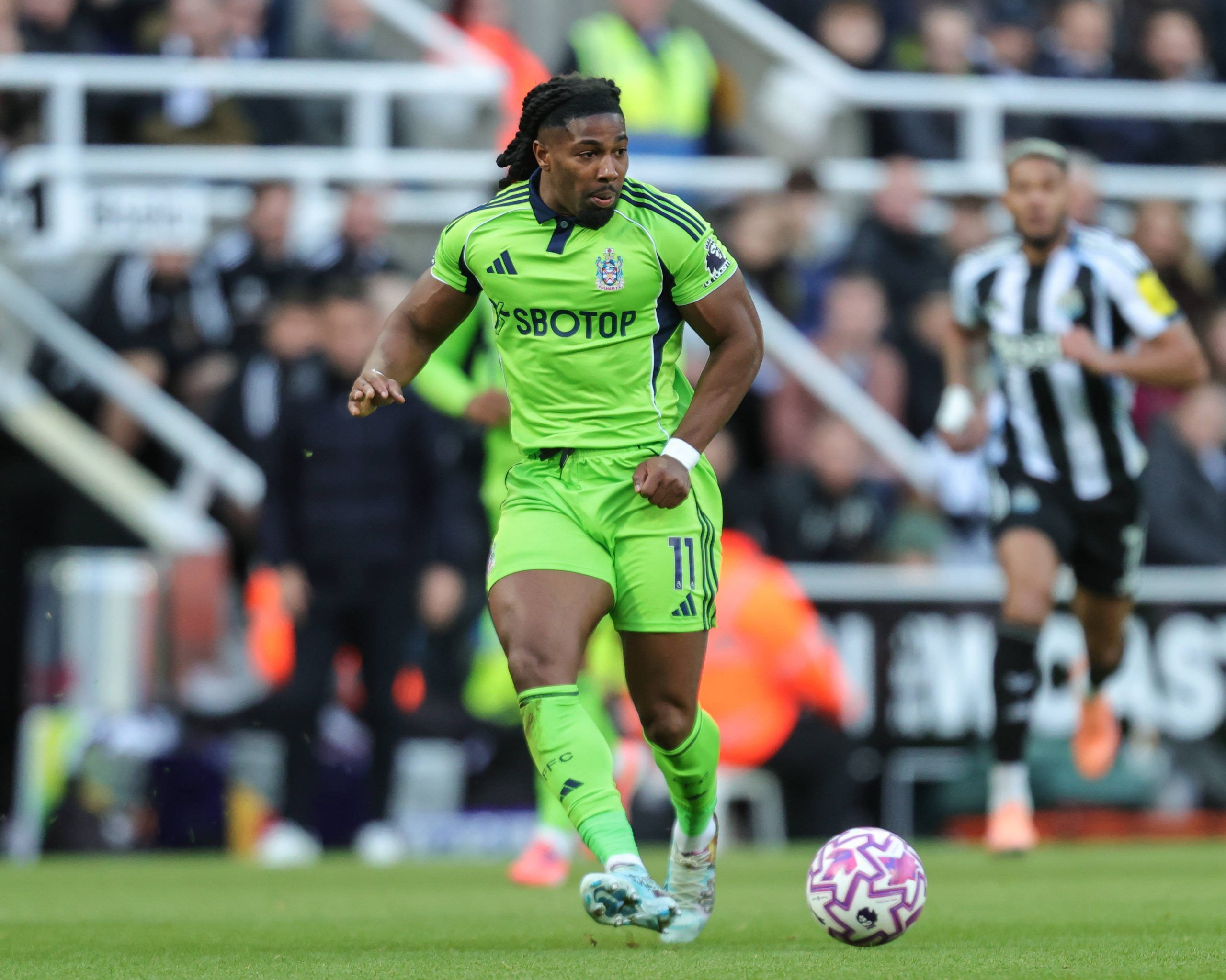  Adama Traore passes the ball during the Premier League match Newcastle United vs Fulham