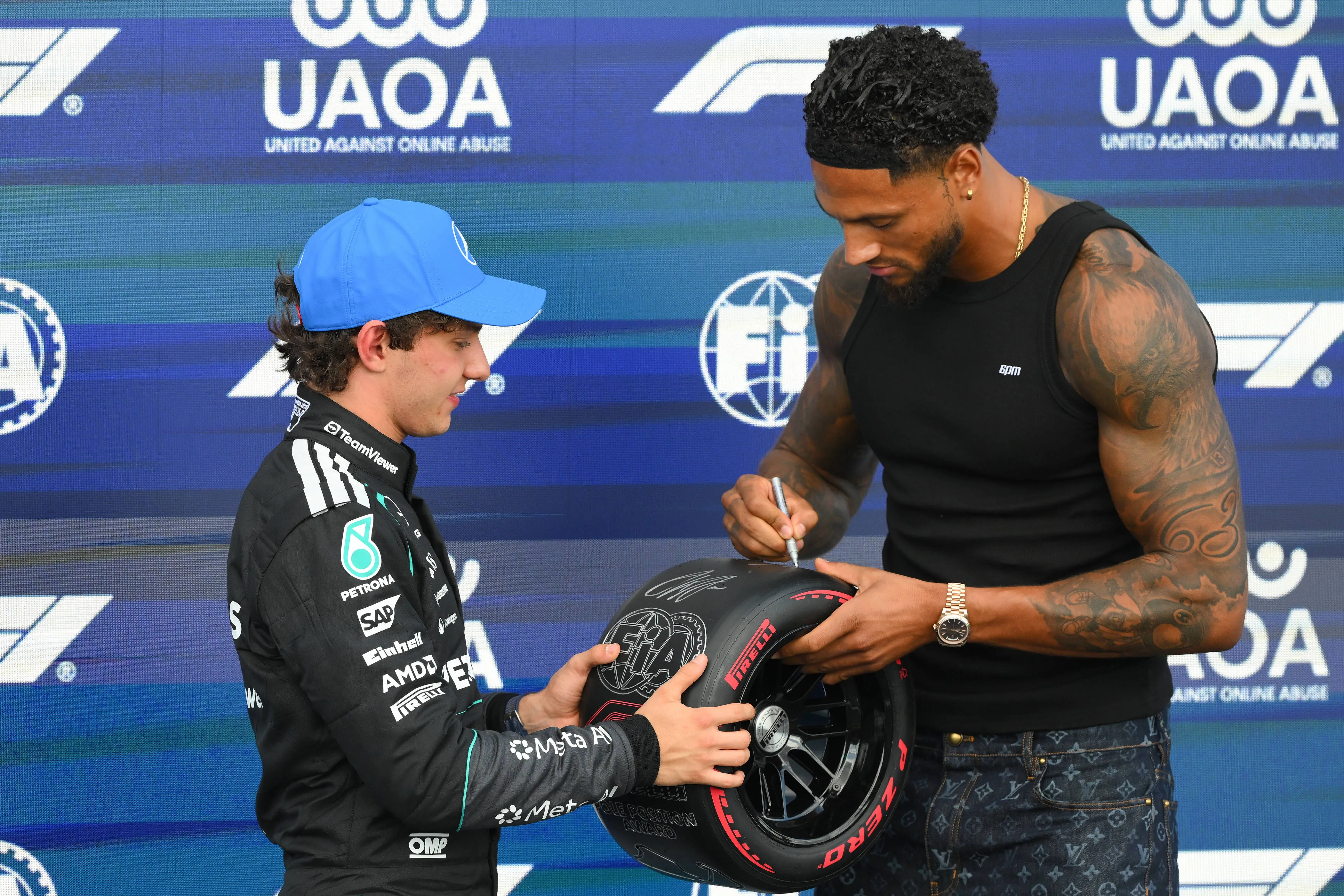F1 Grand Prix of Great Britain - Kimi Antonelli of Italy and the Mercedes-AMG PETRONAS Formula One Team celebrates with Maduka Okoye after securing P1 during qualifying for the Formula 1 Pirelli British Grand Prix 2026 at Silverstone Circuit, Towcester