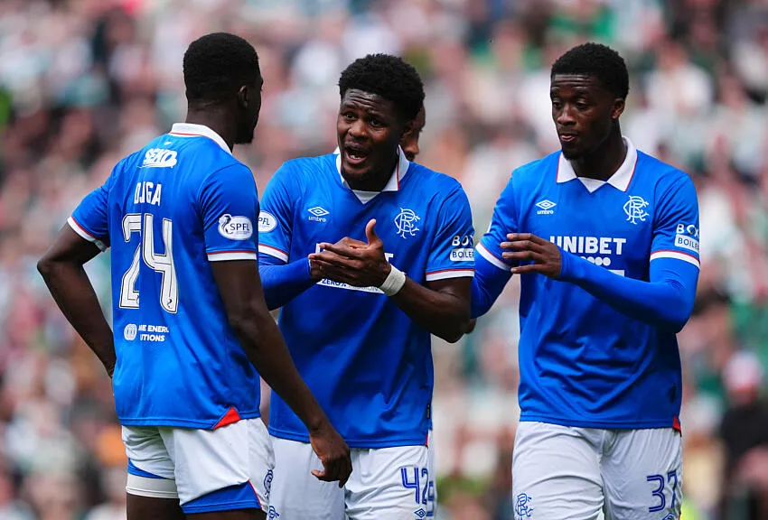 Rangers' Tochi Chukwuani speaks with Nasser Djiga and Emmanuel Fernandez