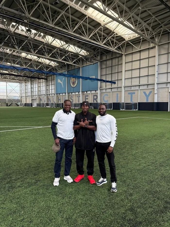 Grassrunners CEO Gbenga Agbejoye with Angelo Agbejoye at Manchester City training complex