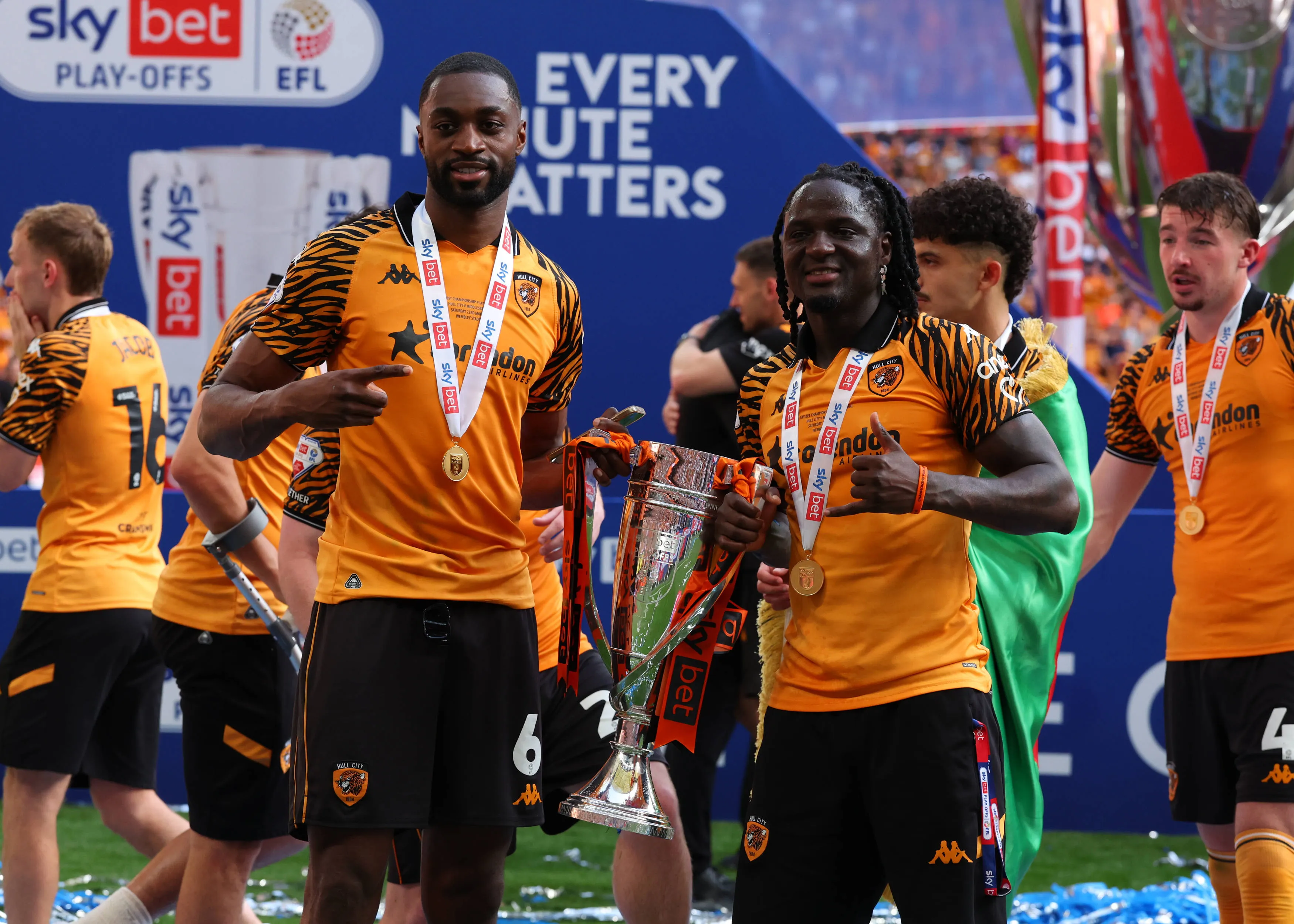 Semi Ajayi and James Debayo of Hull City pose with the EFL Championship Play-offs Final Trophy