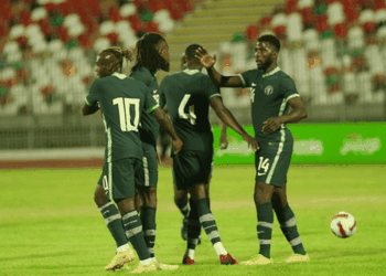 Super Eagles hopeful presents jersey to Buhari in Portugal