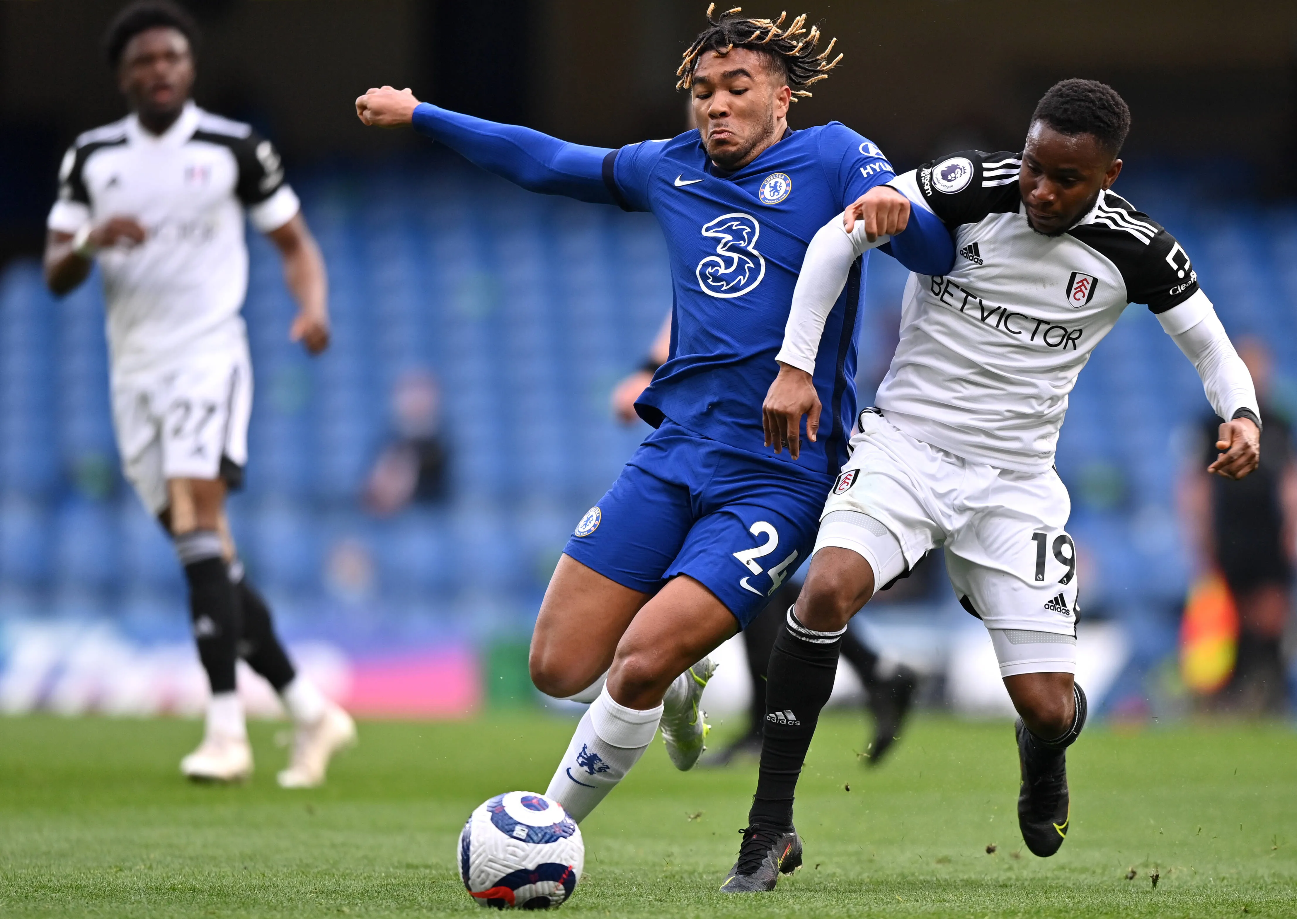 Chelsea's Reece James and Fulham's Ademola Lookman battle for the ball