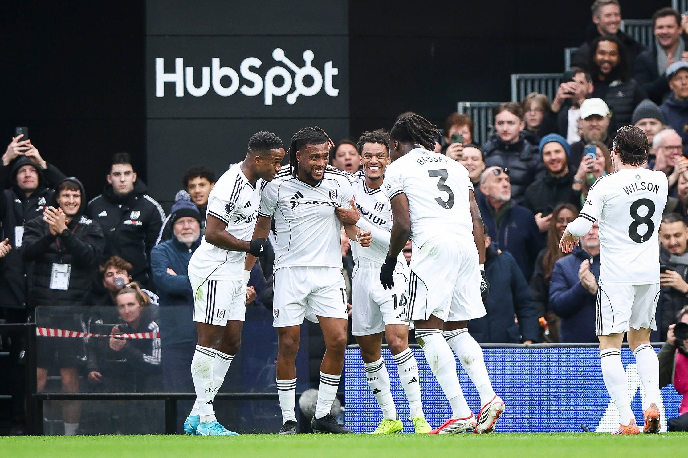 Alex Iwobi of Fulham scores and celebrates