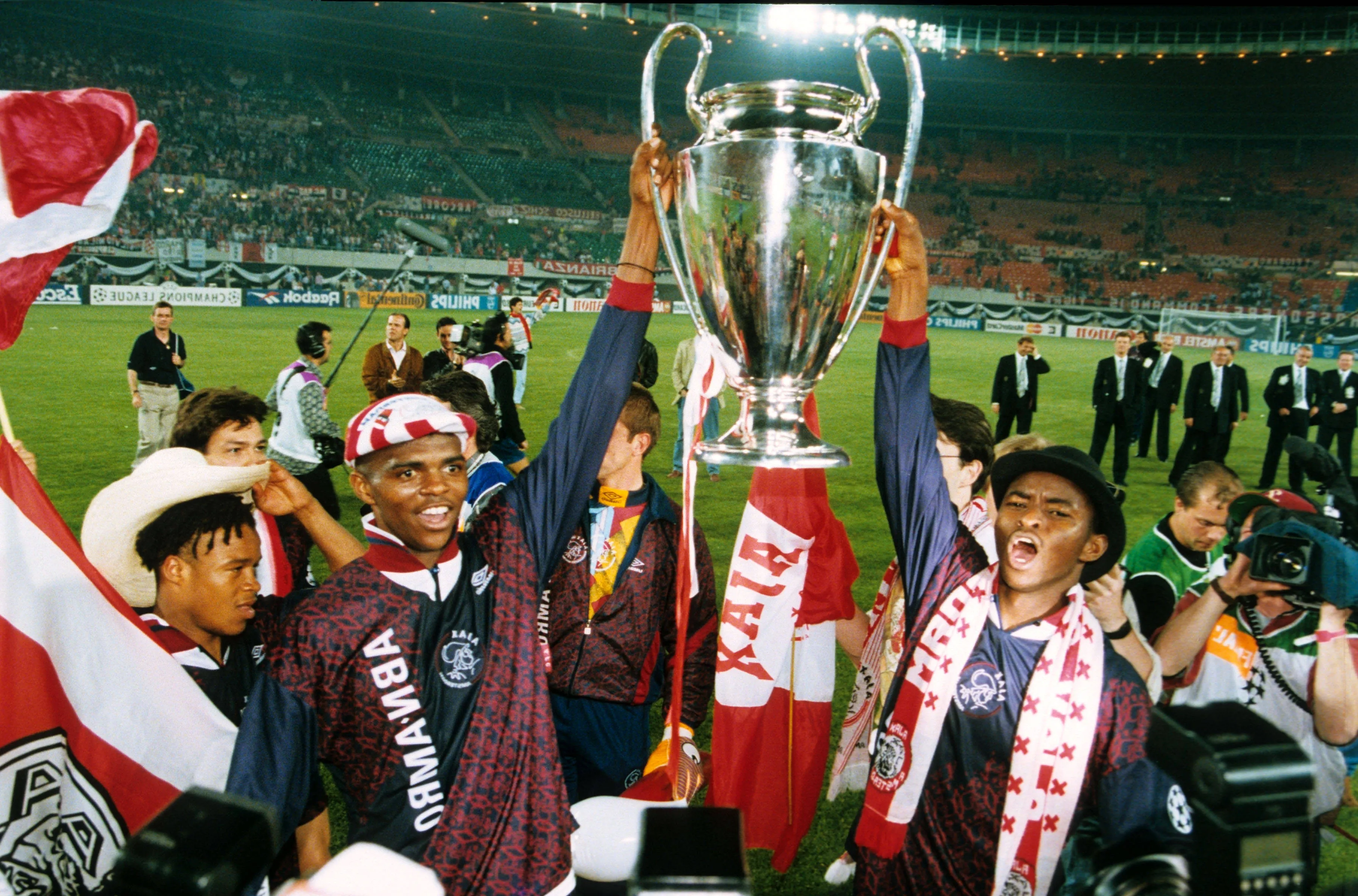 Ajax's Nwankwo KANU and Finidi GEORGE celebrating with the UCL trophy