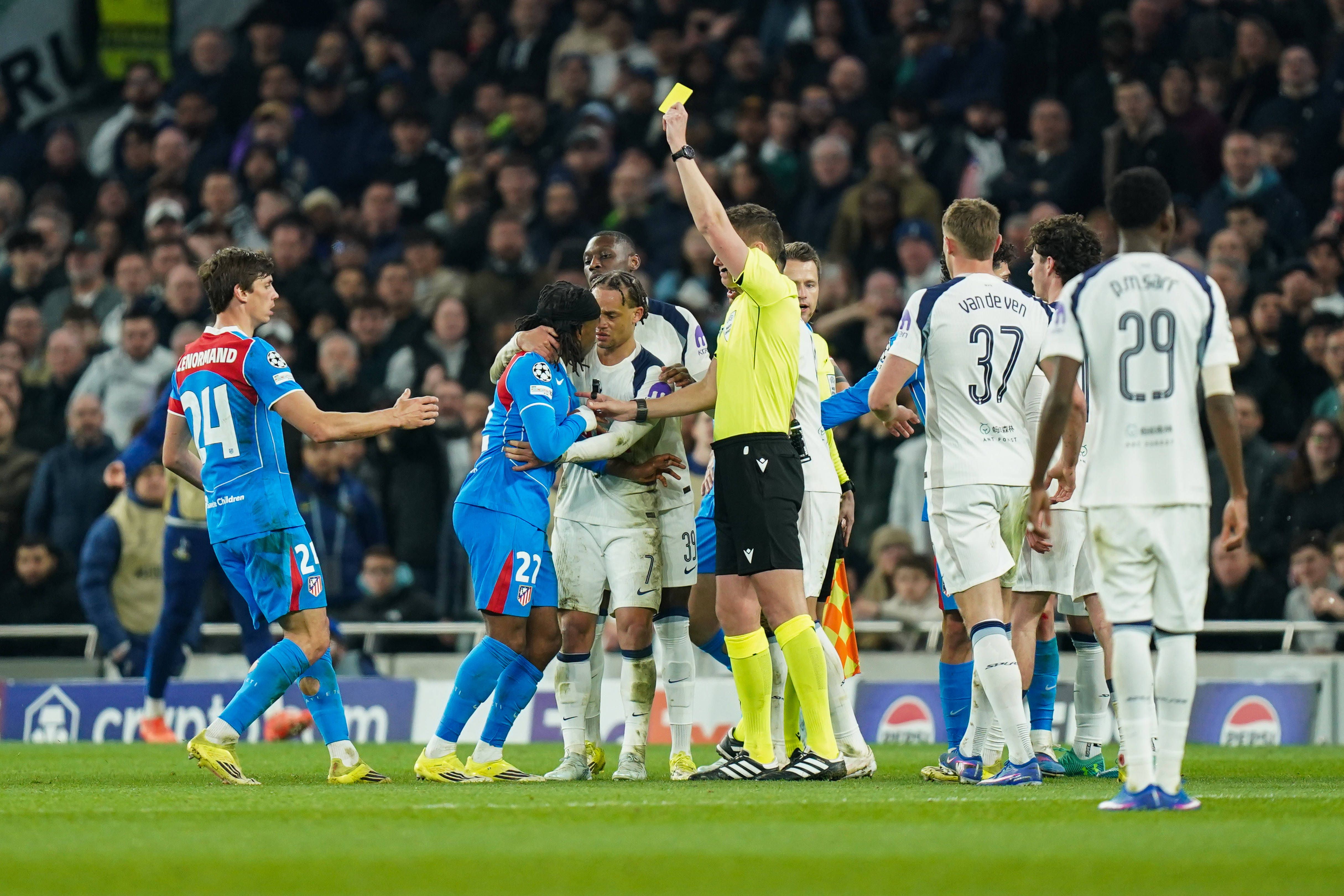 Ademola Lookman being shown a yellow card during the Tottenham Hotspur v Atletico Madrid clash