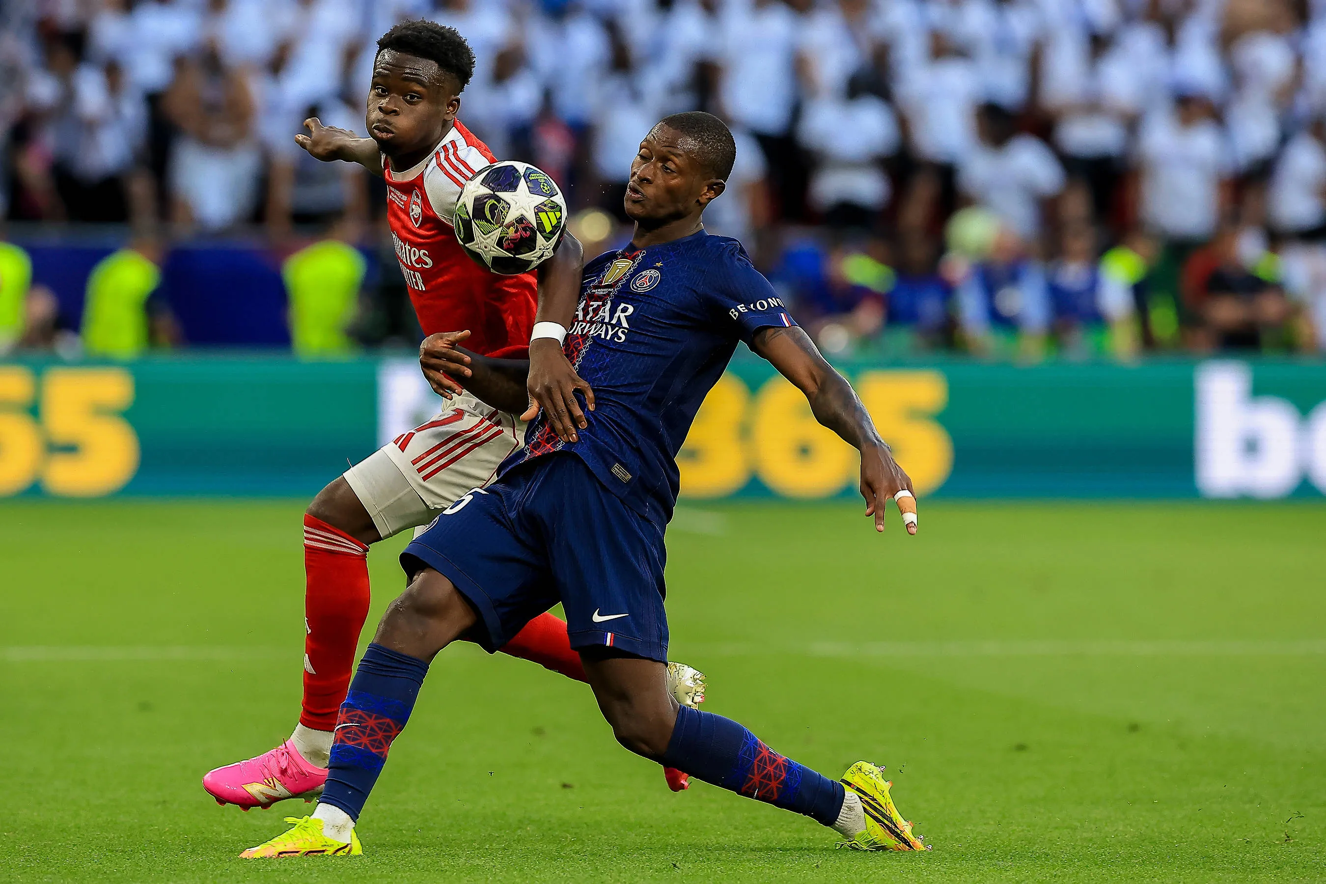 Bukayo Saka and Nuno Mendes during the Arsenal vs PSG UCL final