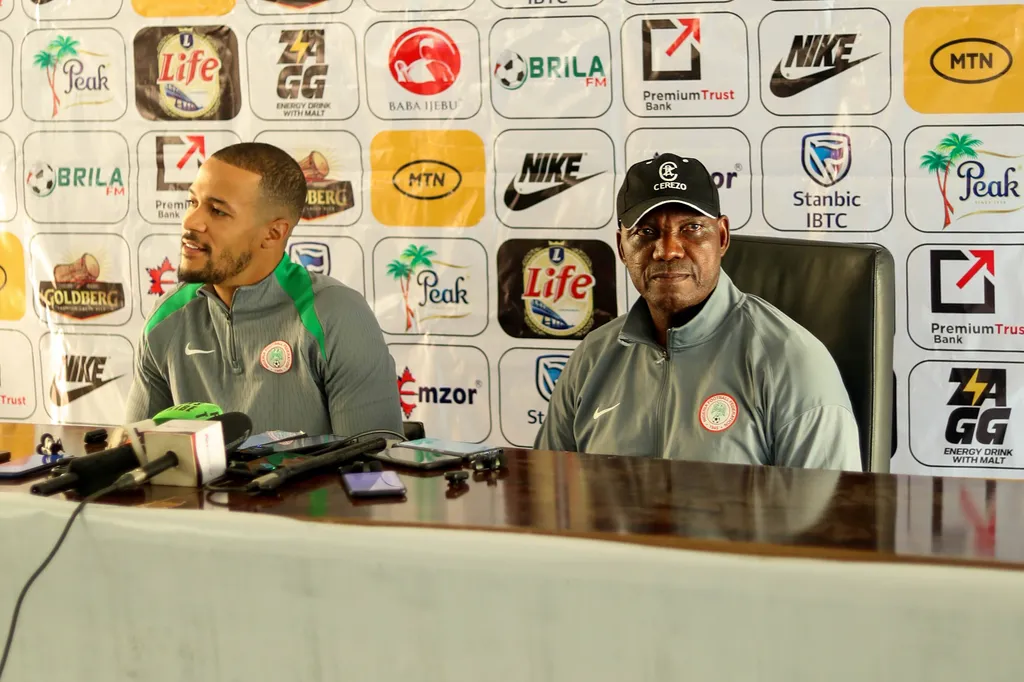 Ekong William and Augustine Eguavoen during the Men's 2025 AFCON qualifier match between Nigeria and Rwanda at Godwill Akpabio Stadium on November
