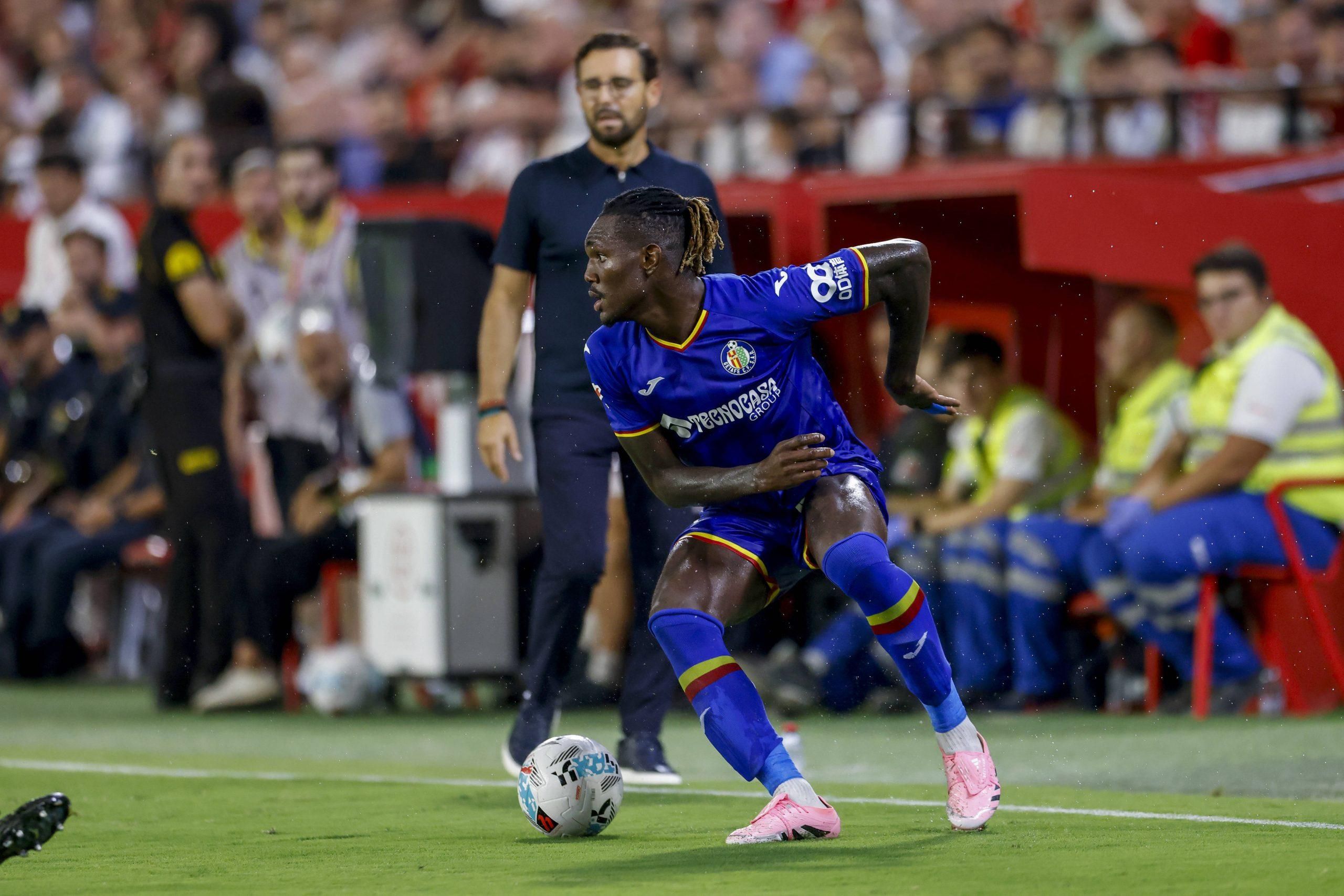 Christantus Uche of Getafe CF controls the ball during the La Liga EA Sports match between Sevilla FC and Getafe CF at Ramon Sanchez Pizjuan