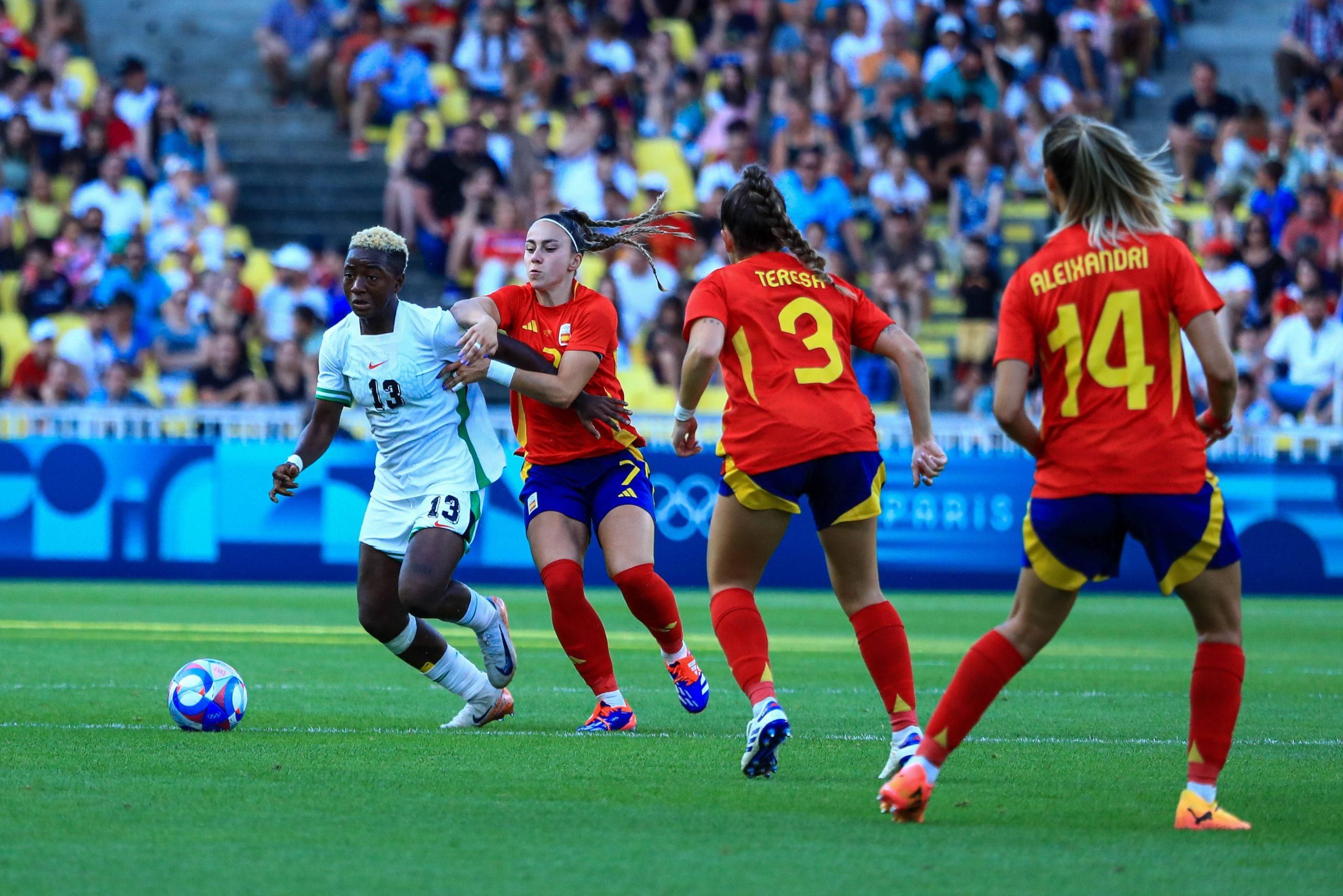 Deborah Abiodun of Nigeria and Athenea del Castillo, Teresa Abelleira and Laia Aleixandri of Spain during the Paris Olympics 2024 Women s Group C match between Spain and Nigeria 