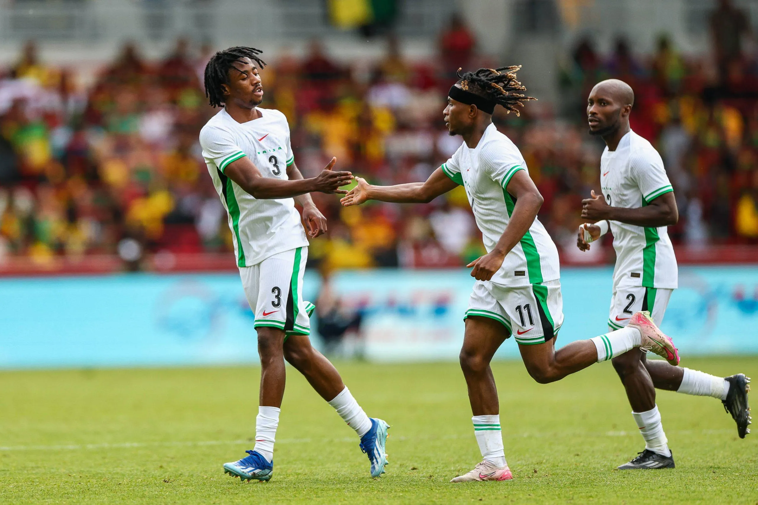 Nigeria defender Benjamin Fredrick 3 congratulates, Nigeria forward Samuel Chukwueze 11 after his goal during the Unity Cup Final, London 2025 match between Jamaica and Nigeria at Gtech Community Stadium