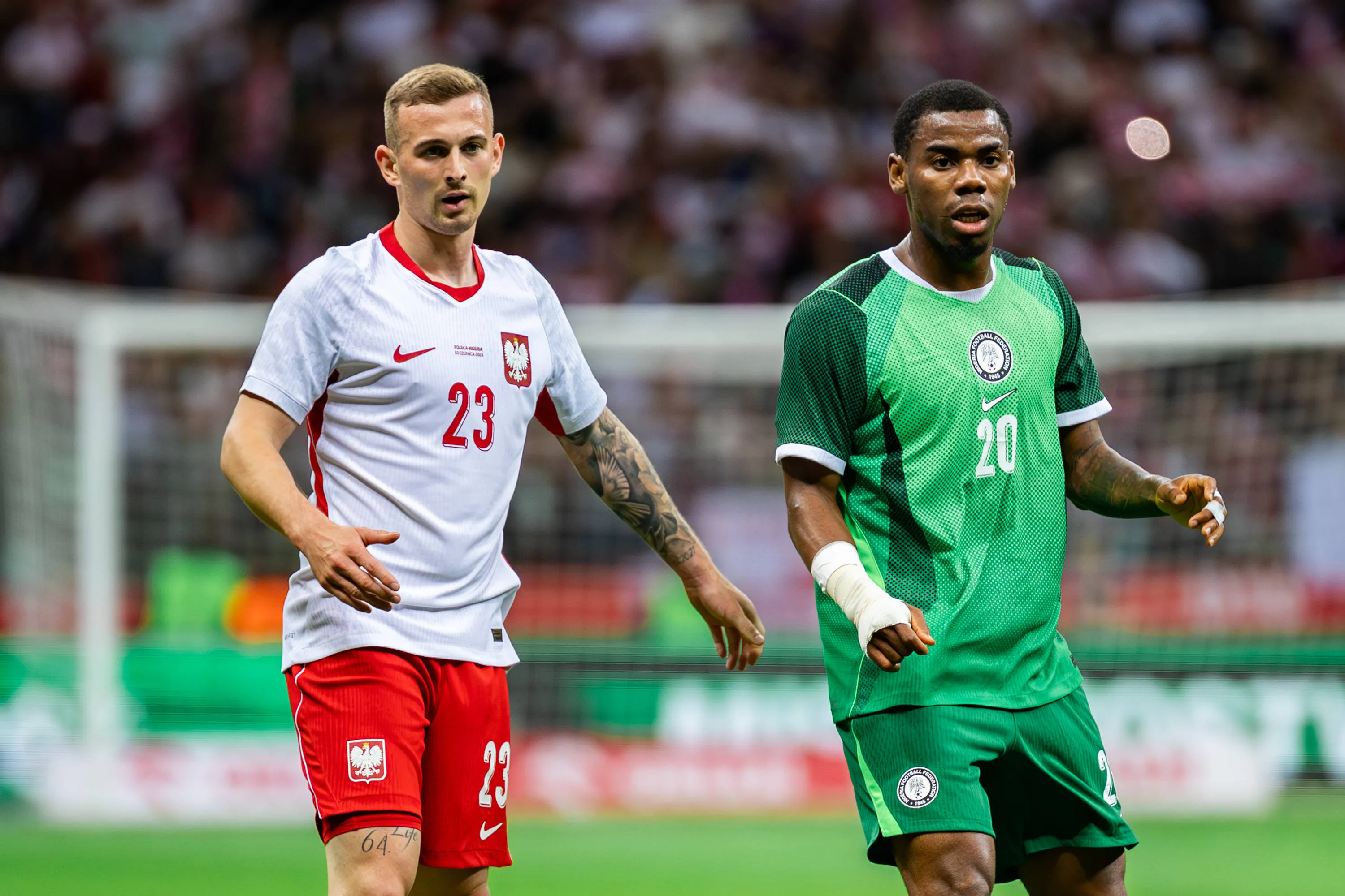 Kacper Kozlowski L of Poland and Raphael Onyedika R of Nigeria are seen during the friendly match between Poland and Nigeria at PGE Narodowy Stadium