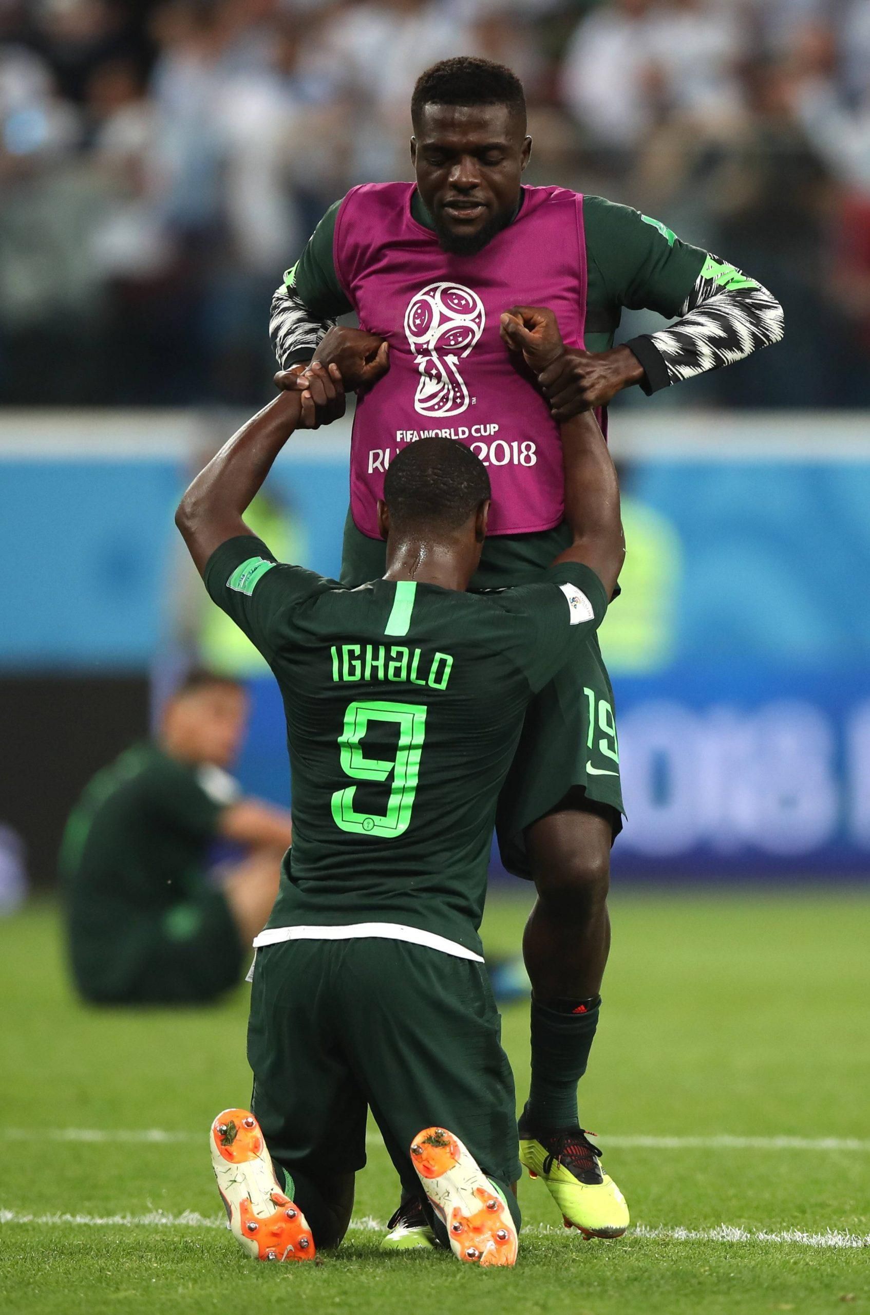 John Ogu of Nigeria comforts Odion Ighalo after the 2018 FIFA World Cup Group D match between Nigeria and Argentina