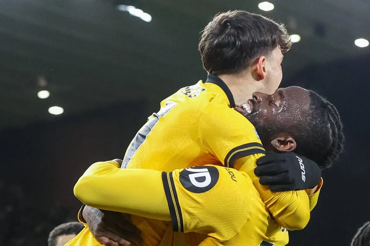 Rodrigo Gomes and Tolu Arokodare celebrate Wolves goal vs Liverpool