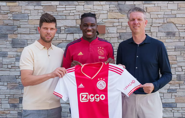 Bassey with Ajax officials