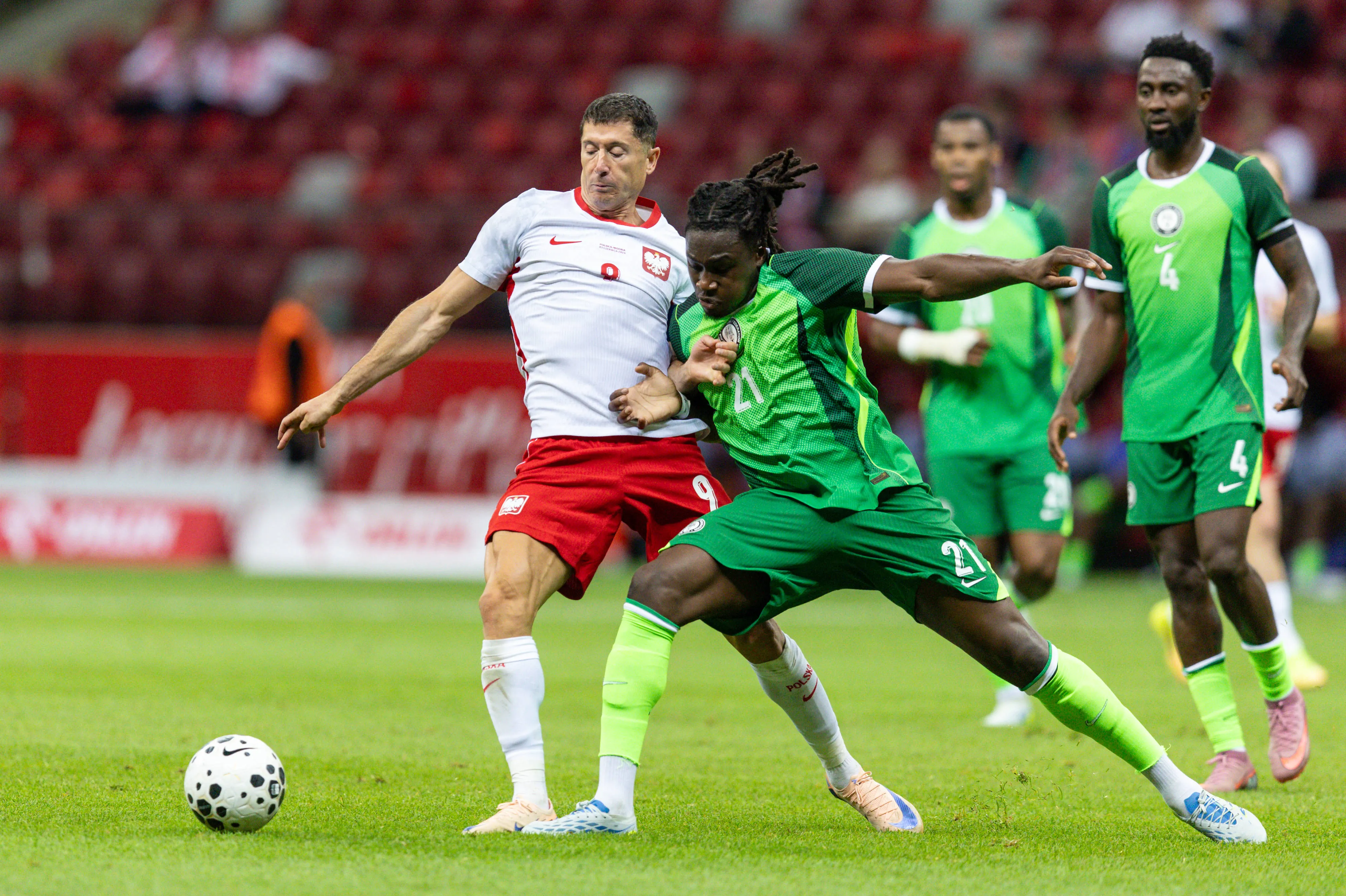 Super Eagles defender Calvin Bassey against legendary Polish forward Robert Lewandowski