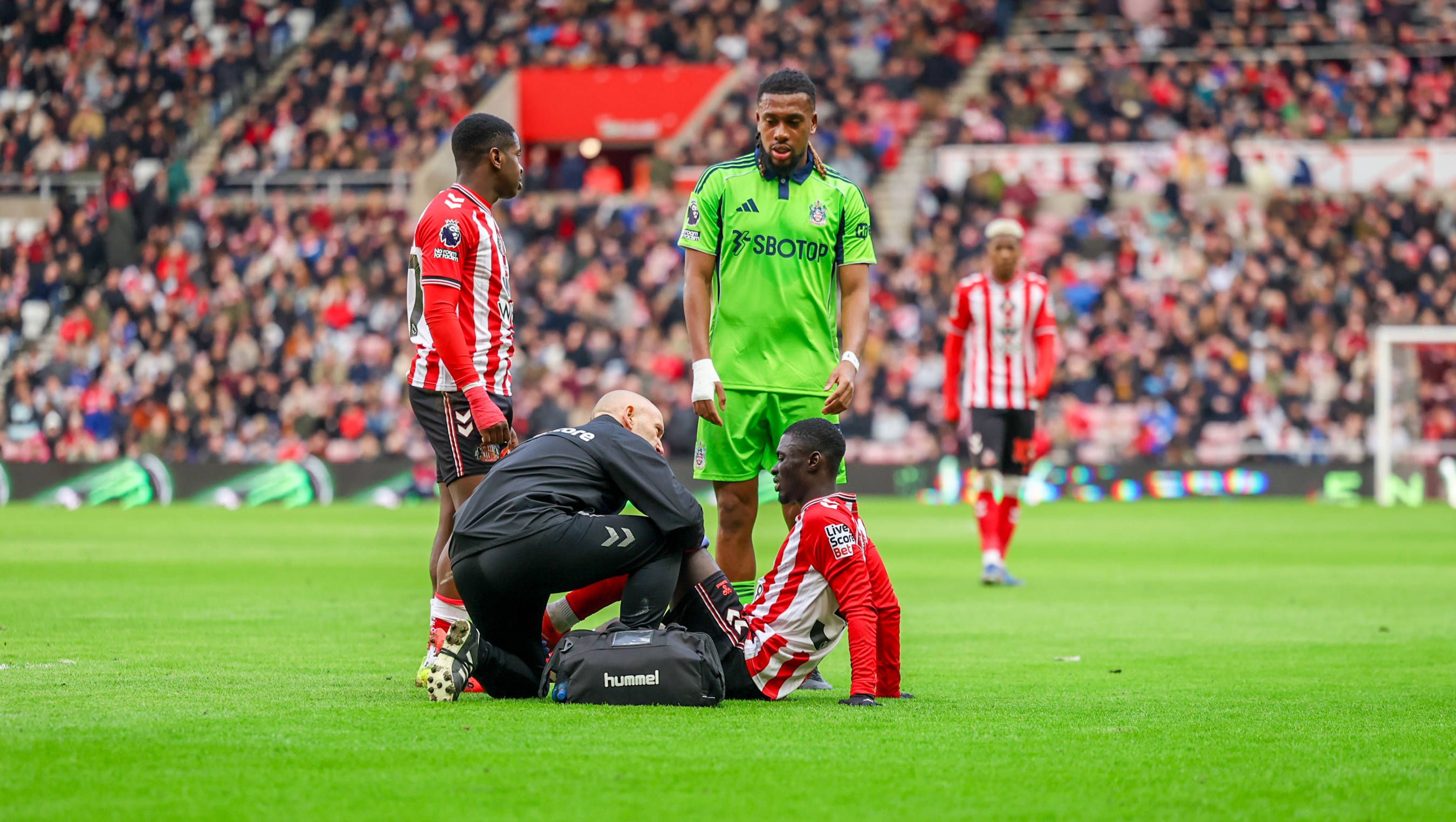 Iwobi watches as Jocelin Ta Bi feels an injury and is substituted during the Premier League match between Sunderland and Fulham at the Stadium Of Light