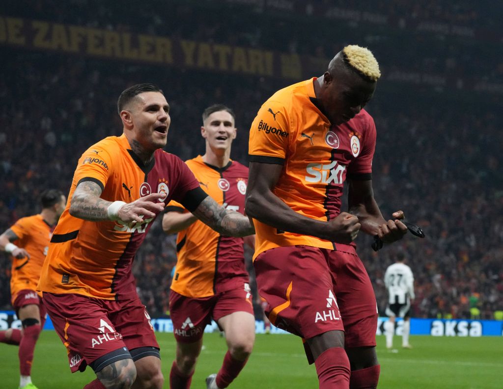 Victor Osimhen celebrates after scoring the second goal of his team with Mauro Icardi during the Turkish Super League derby match between Galatasaray and Besiktas at Rams Park Stadium in Istanbul