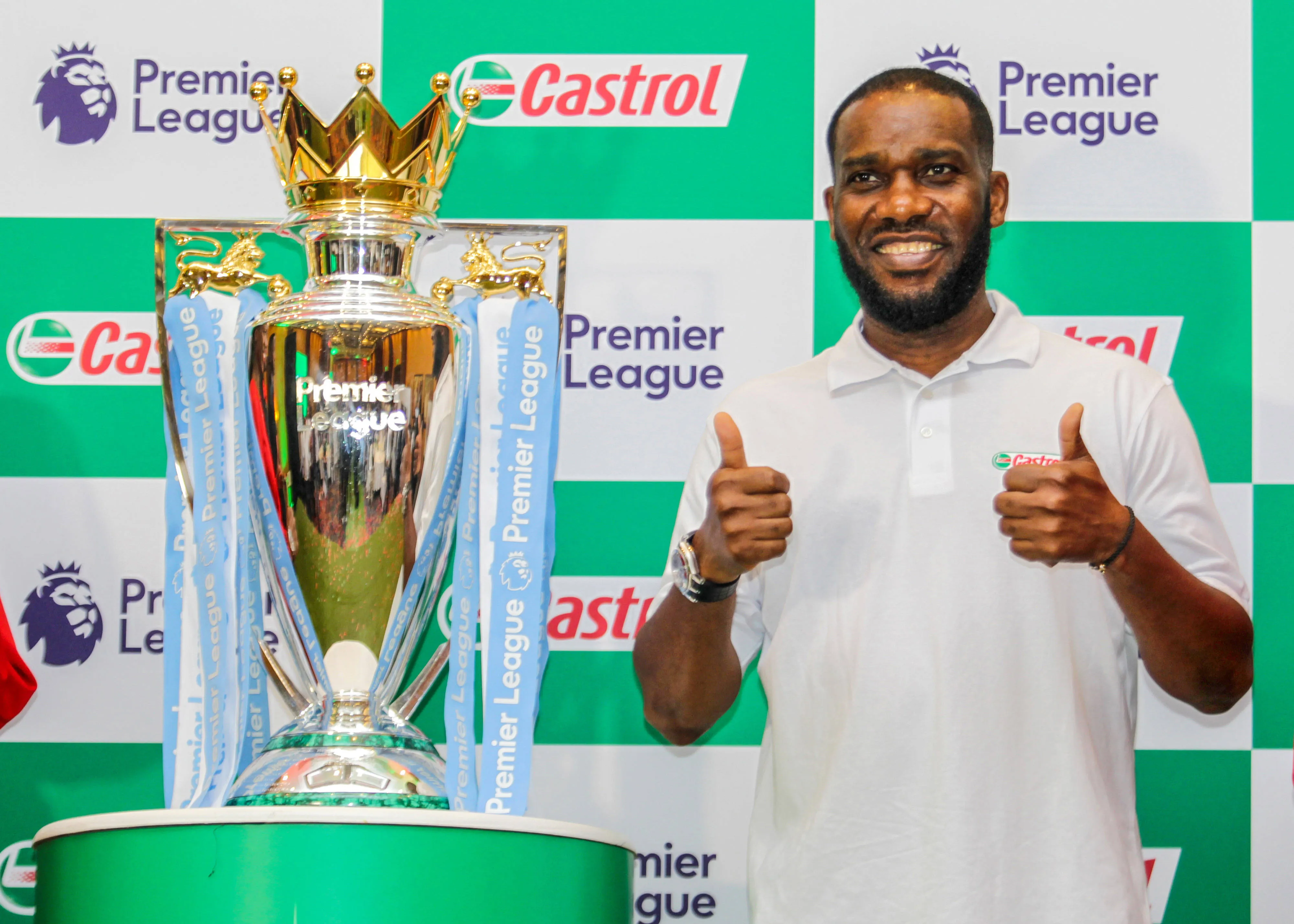 Jay-Jay Okocha with the Premier League trophy.