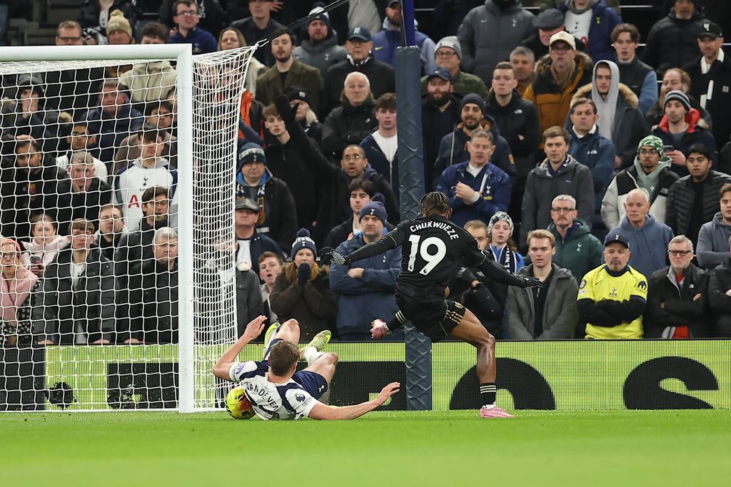 Micky van de Ven makes a last ditch sliding tackle against Samuel Chukwueze who had gotten past goalkeeper Guglielmo Vicario of Tottenham Hotspur