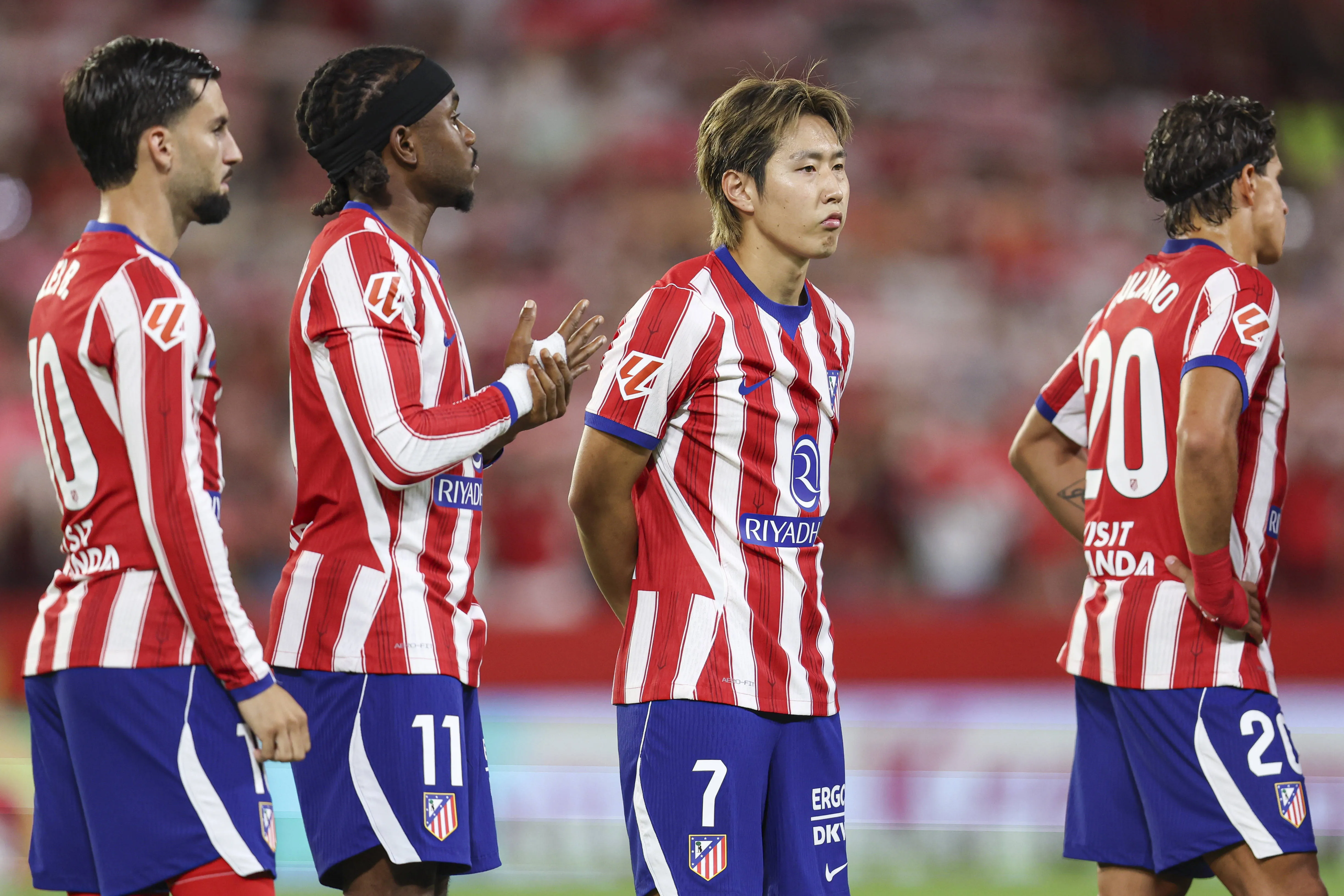 Atletico Madrid players with Ademola Lookman.