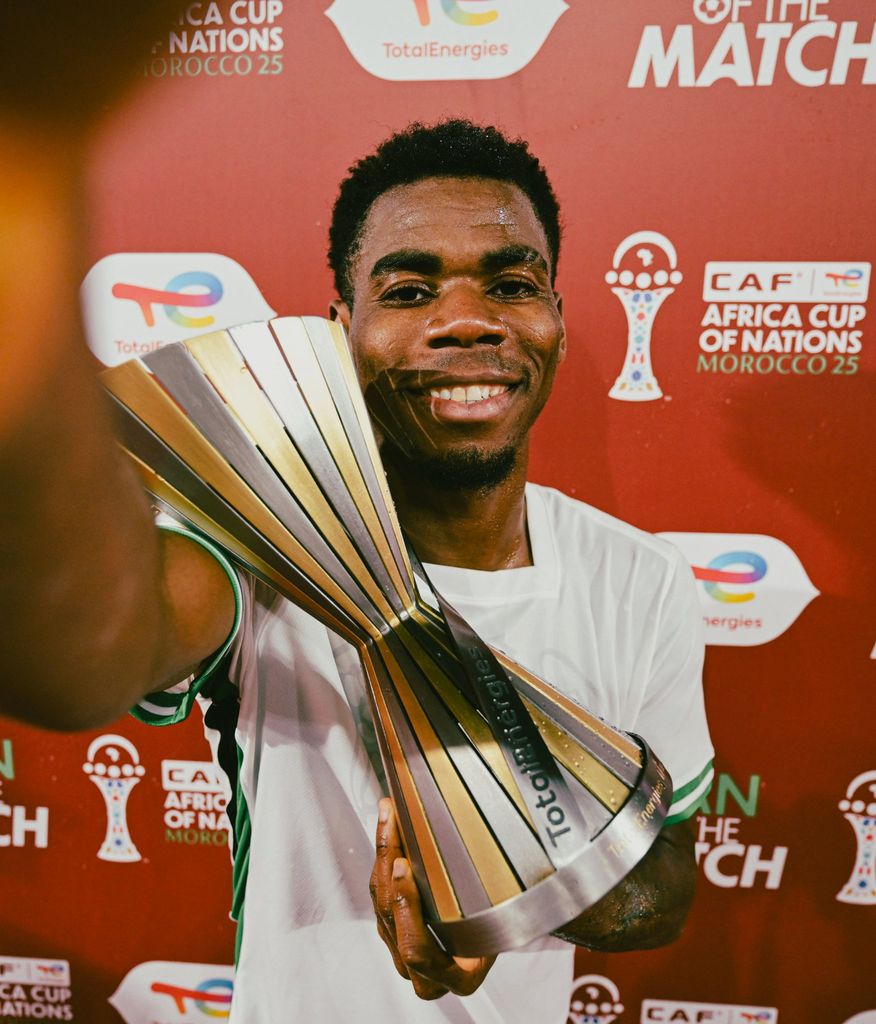 Raphael Onyedika with the CAF Man of the Match Award for a brilliant display against Uganda