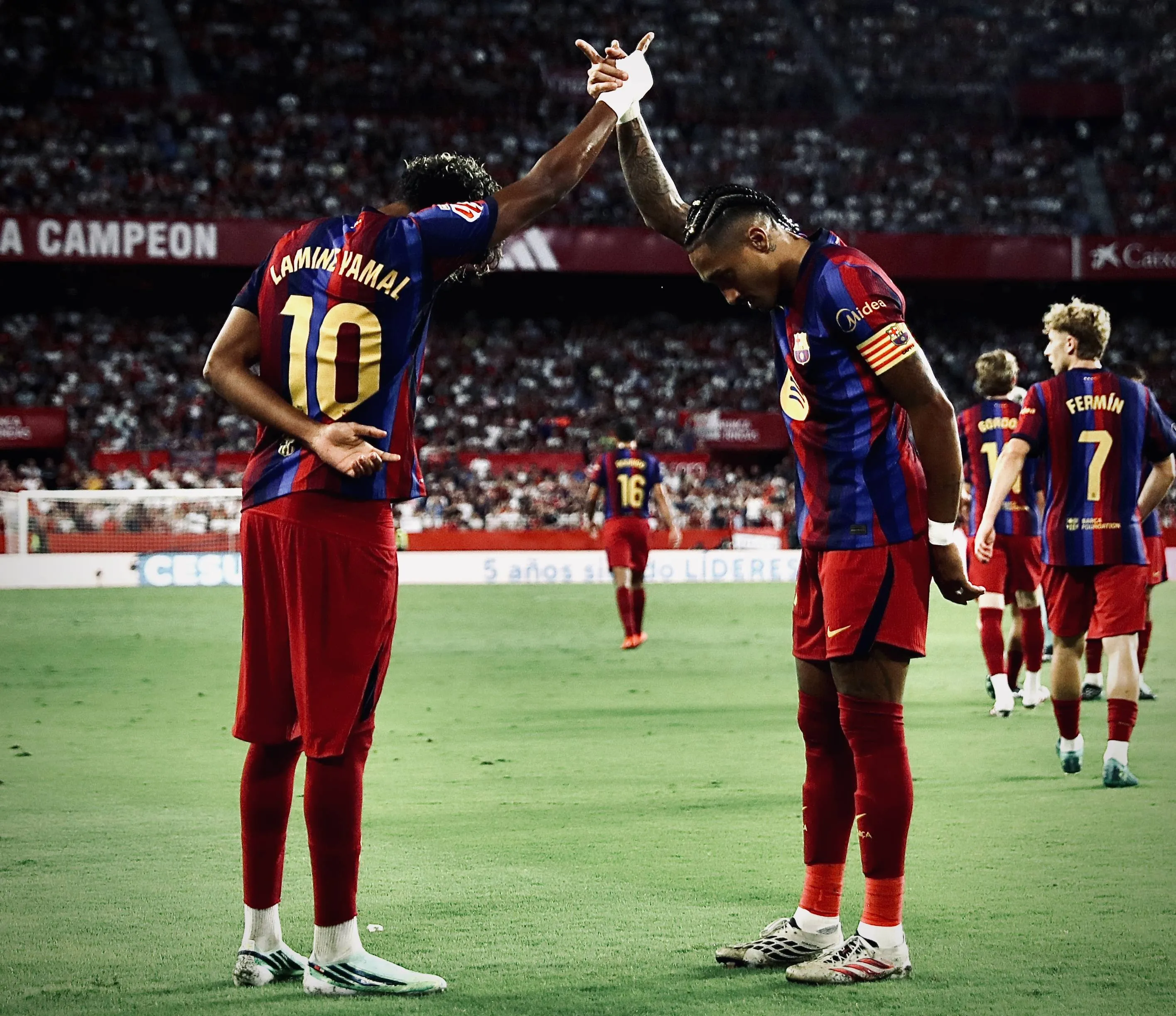  Lamine Yamal of FC Barcelona celebrates his goal with Raphinha