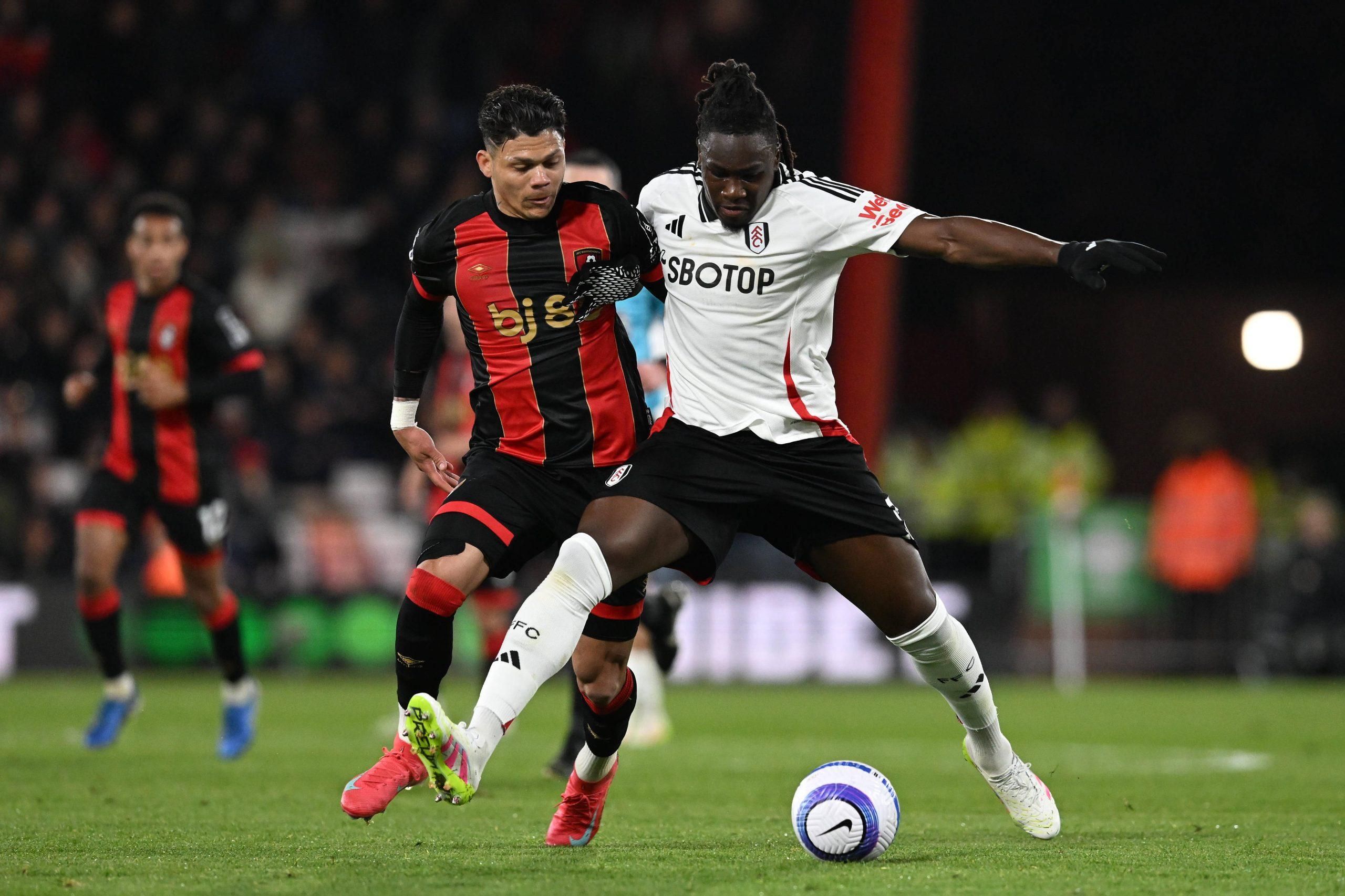 Evanilson 9 of AFC Bournemouth battles for possession with Calvin Bassey 3 of Fulham