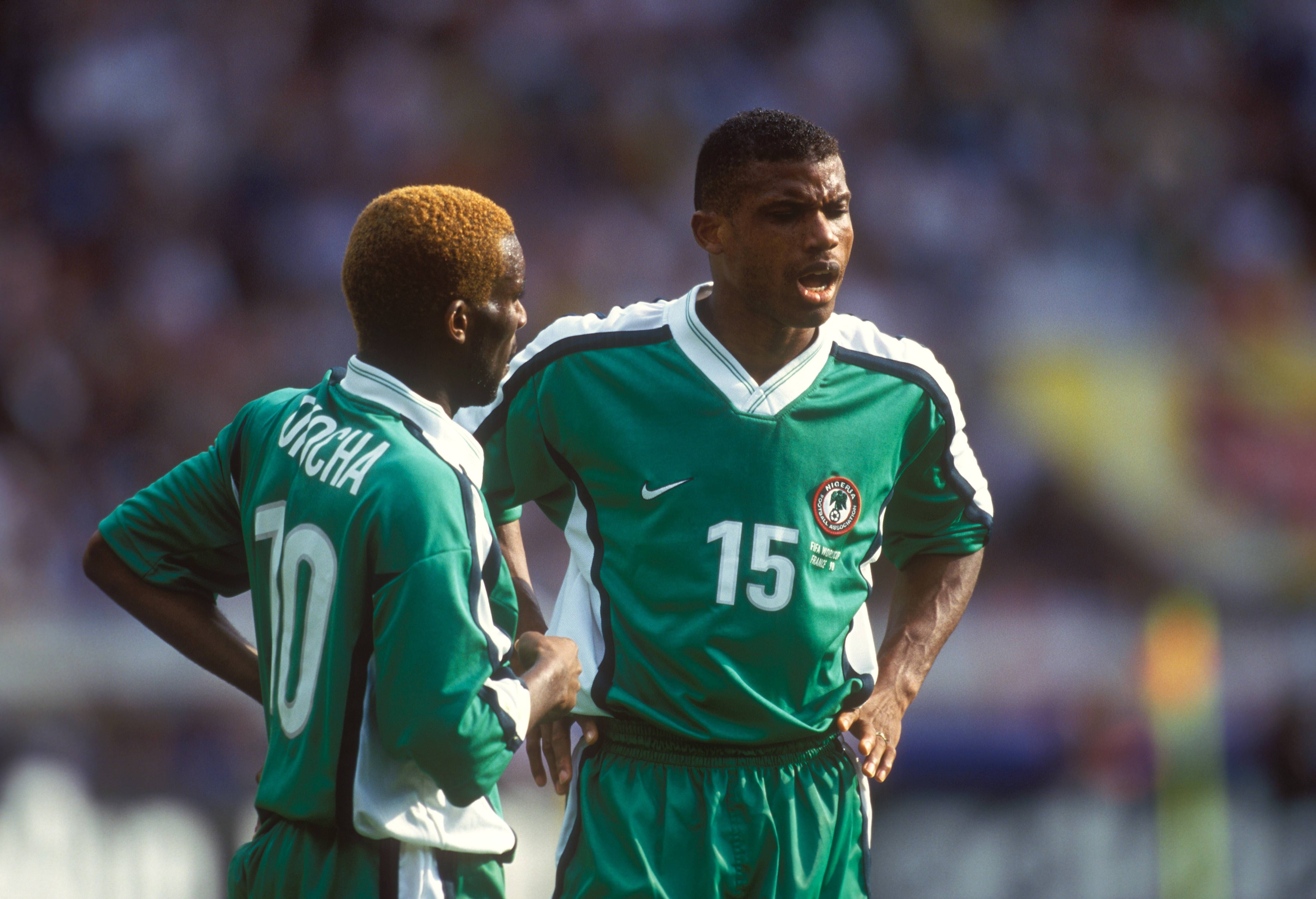 Sunday Oliseh and Jay-Jay Okocha in action for the Super Eagles of Nigeria