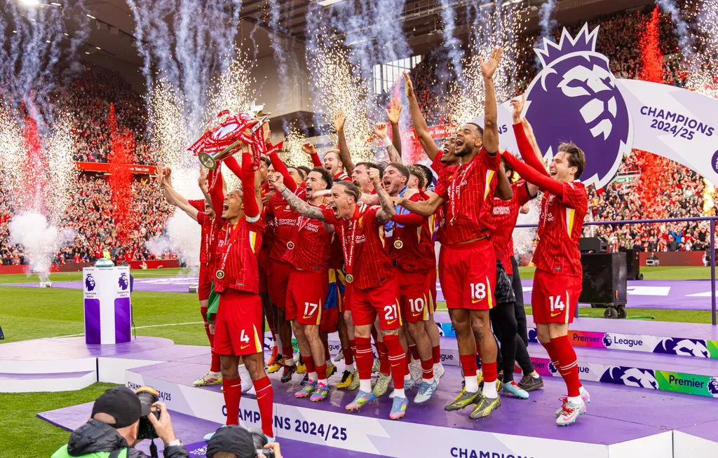 Liverpool players celebrating with the Premier League trophy in May 2025