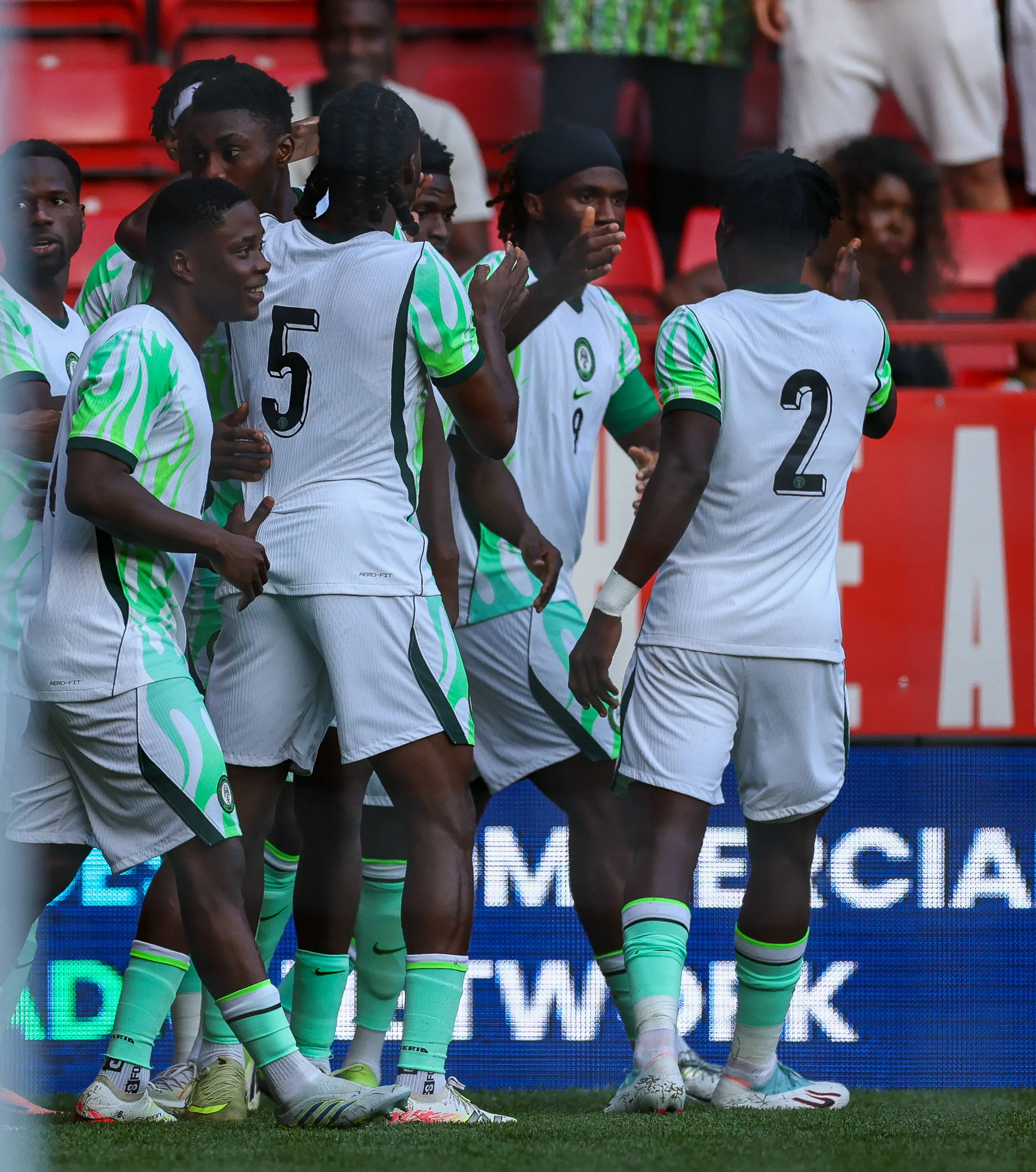 Nigeria midfielder Alhassan Yusuf celebrates with teammates after scoring