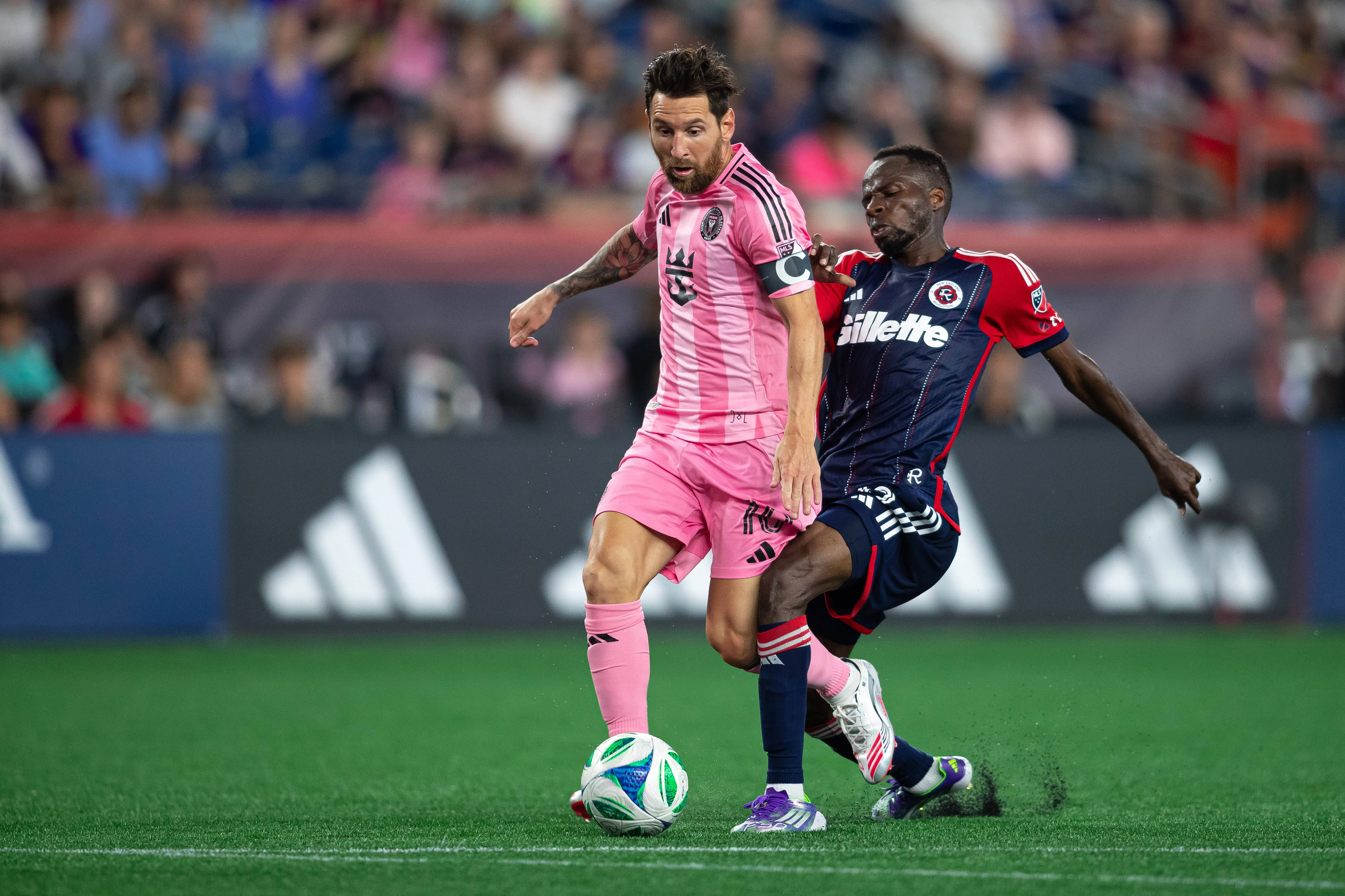 Super Eagles midfielder Alhassan Yusuf and Lionel Messi