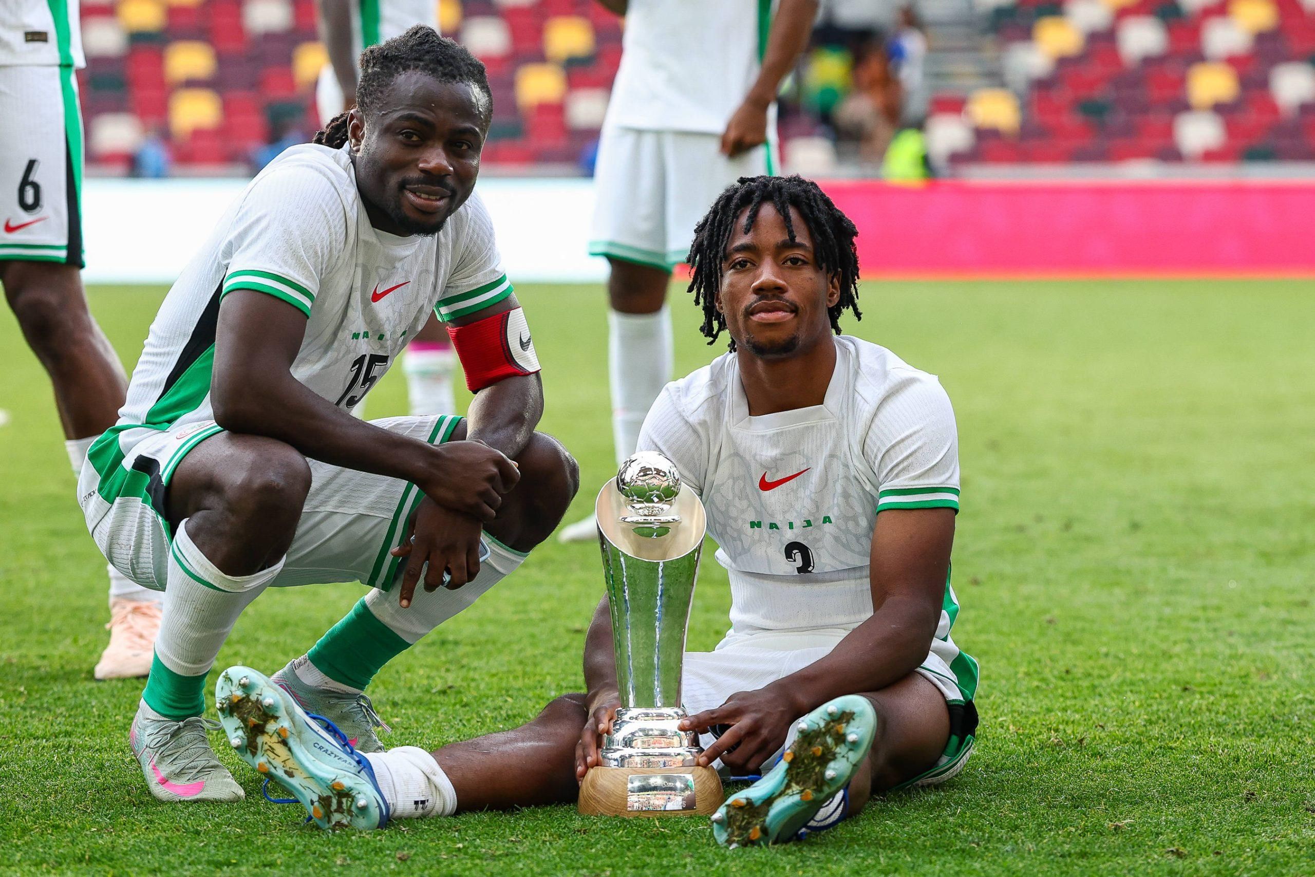 Nigeria forward Moses Daddy Simon 15 and Nigeria defender Benjamin Fredrick 3 pose with the cup after the Unity Cup Final, London 2025 match between Jamaica and Nigeria at Gtech Community Stadium