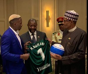 WATCH: Buhari throws funny question to Omeruo as they meet in Spain