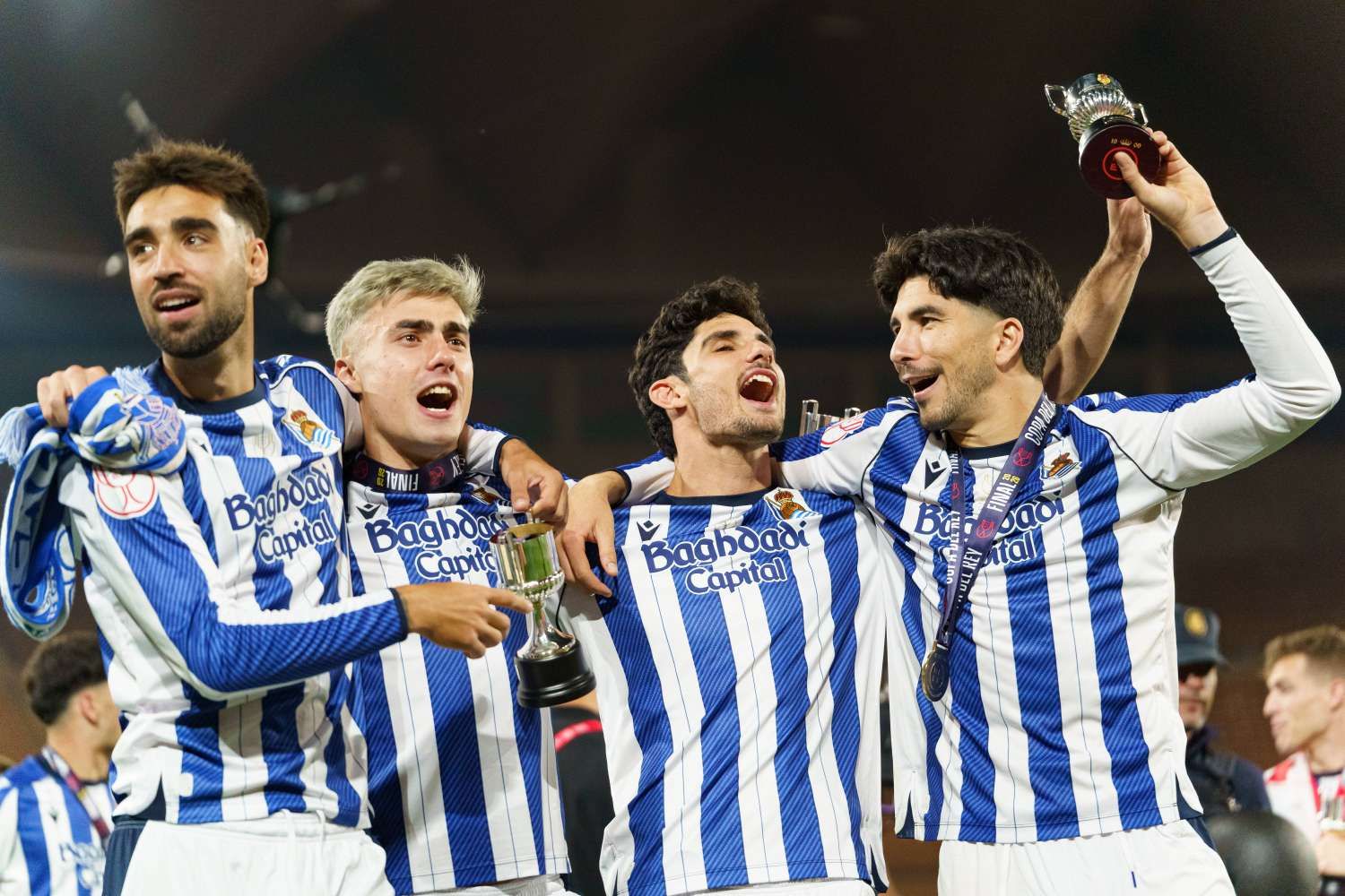 Soccer Real Sociedad players celebrating goal against Atletico Madrid 