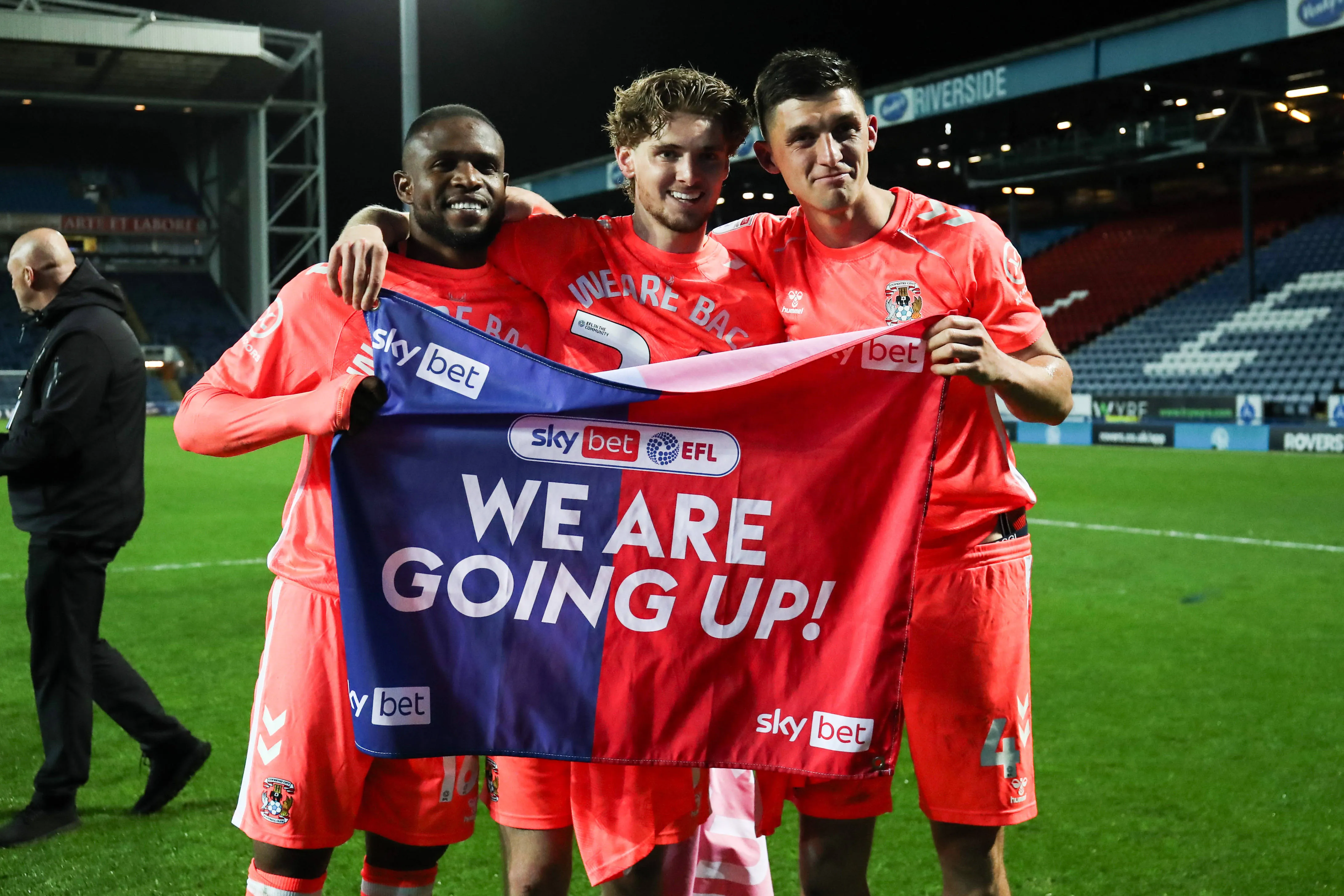 Frank Onyeka of Coventry City and Jack Rudoni of Coventry City and Bobby Thomas of Coventry City celebrates promotion back to the Premier League after the Sky Bet Championship match Blackburn Rovers vs Coventry City at Ewood Park