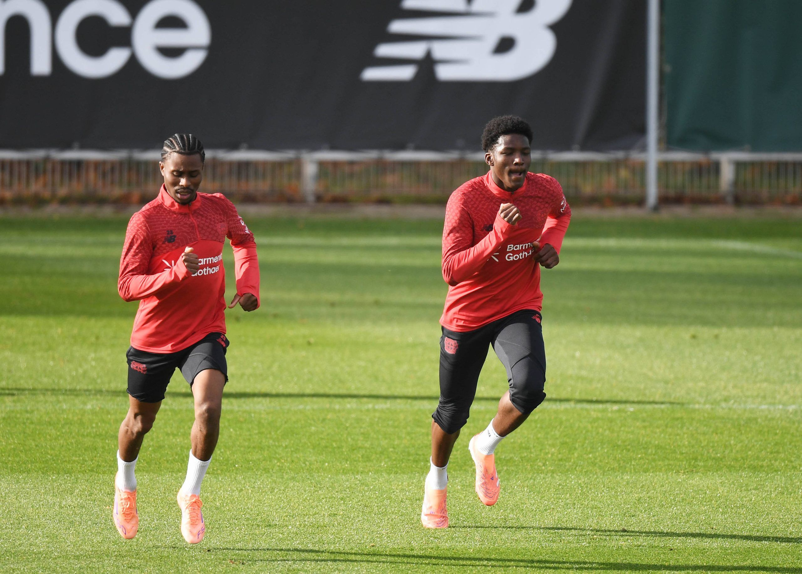Nathan Tella and Axel Tape training at Bayer Leverkusen