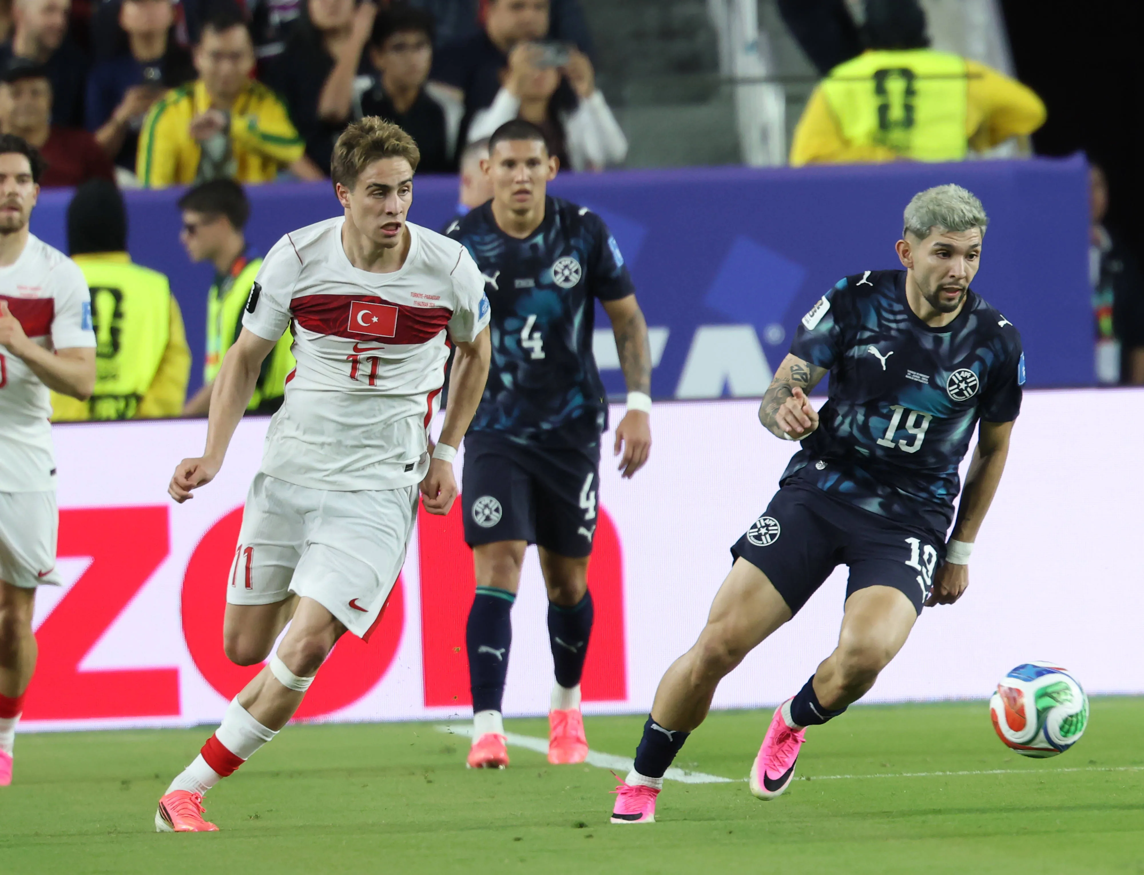 Kenan Yildiz of Turkiye and Julio Enciso of Paraguay compete for the ball during the FIFA World Cup 2026 Group D match between Turkiye and Paraguay at San Francisco Bay Area Stadium in Santa Clara, California, on June 19, 2026