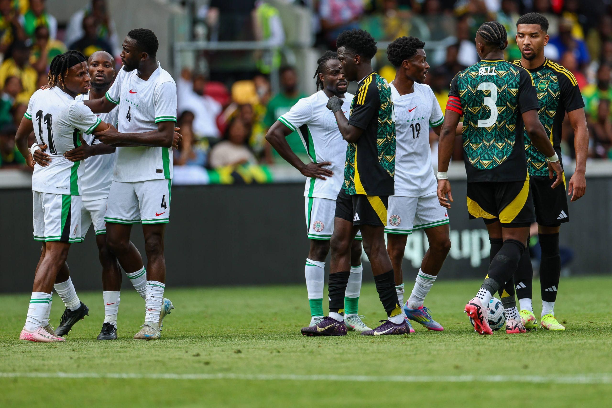 Super Eagles forward Samuel Chukwueze 11 argues with the Jamaica players