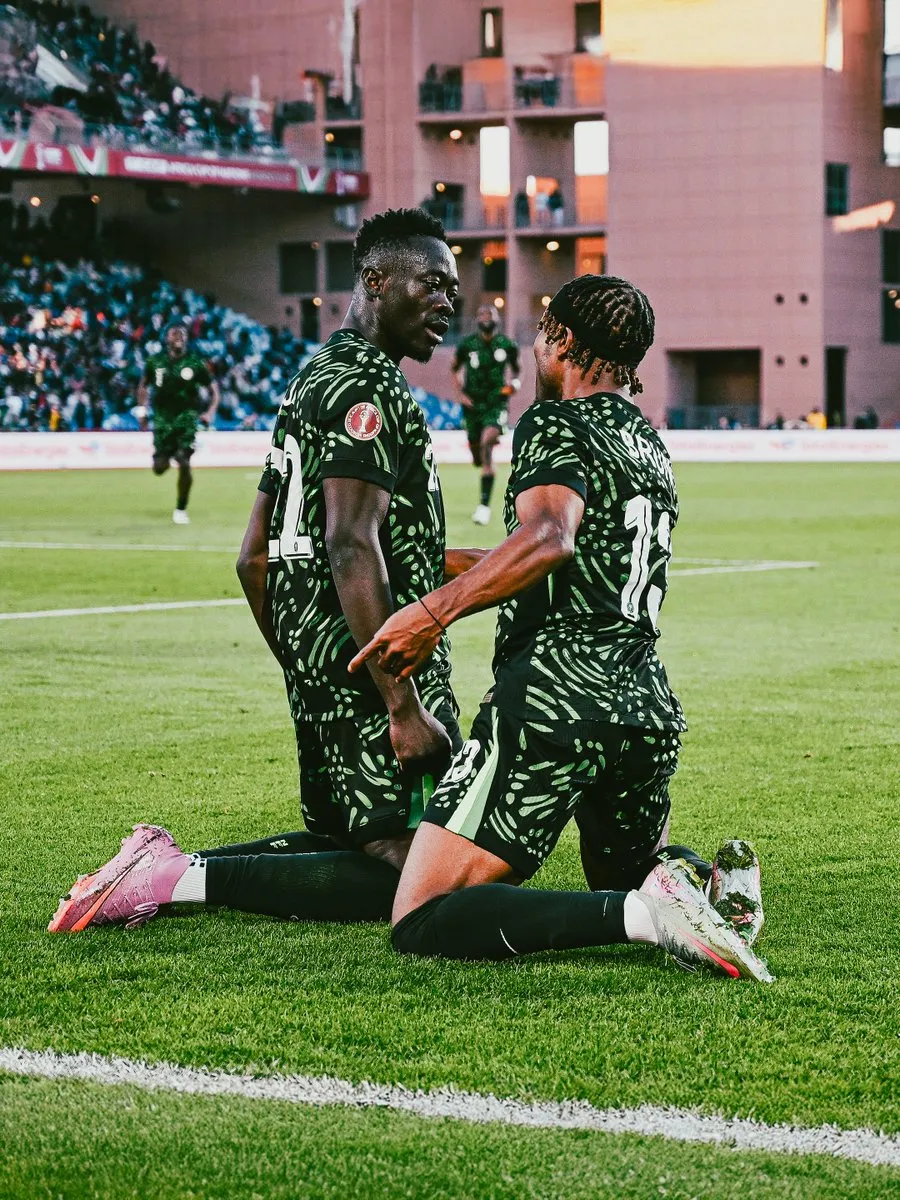 Bruno Onyemaechi celebrates with Akor Adams against Algeria