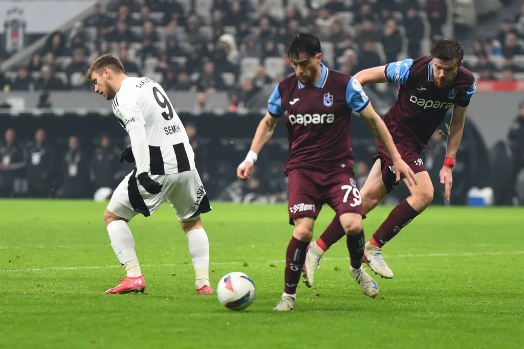 Semih Kilicsoy and Pedro Malheiro, Arsenii Batagov battle for the ball during the Turkish Super League match between Besiktas and Trabzonspor