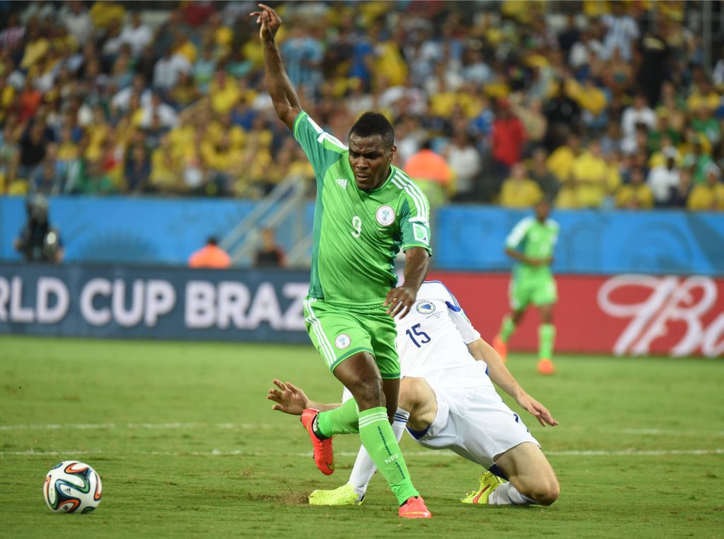 Nigeria's Emmanuel Emenike vies with Bosnia and Herzegovina's Toni Sunjic during a Group F match between Nigeria and Bosnia and Herzegovina of 2014 FIFA World Cup