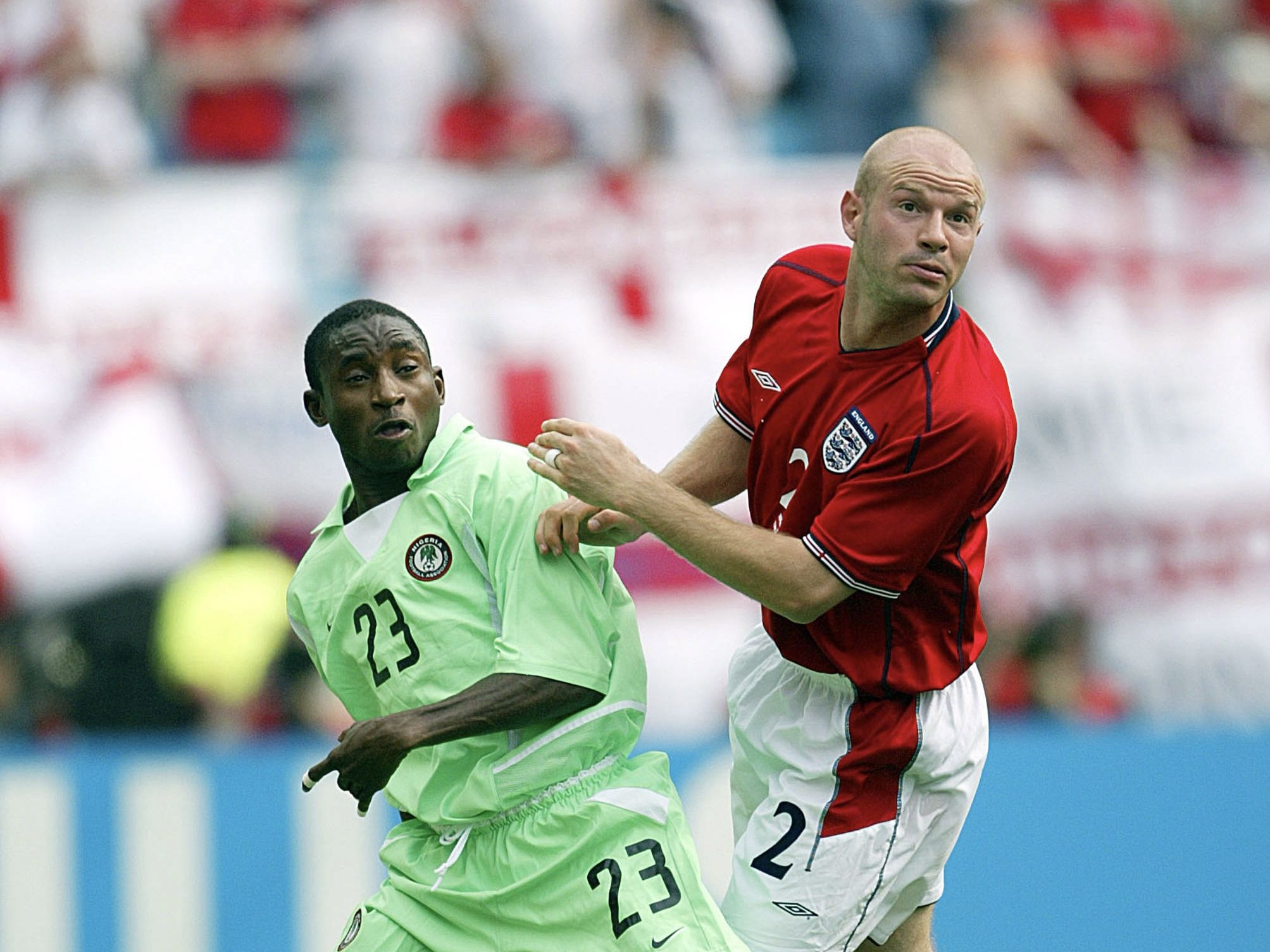 Femi Opabunmi of Nigeria and Danny Mills of England challenge during the FIFA World Cup Finals 2002