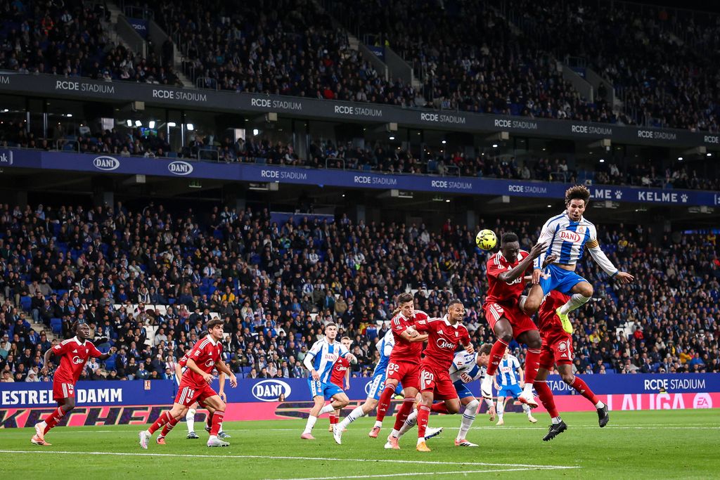 Roberto Fernandez and Akor Adams contest an aerial ball during RCD Espanyol vs Sevilla 