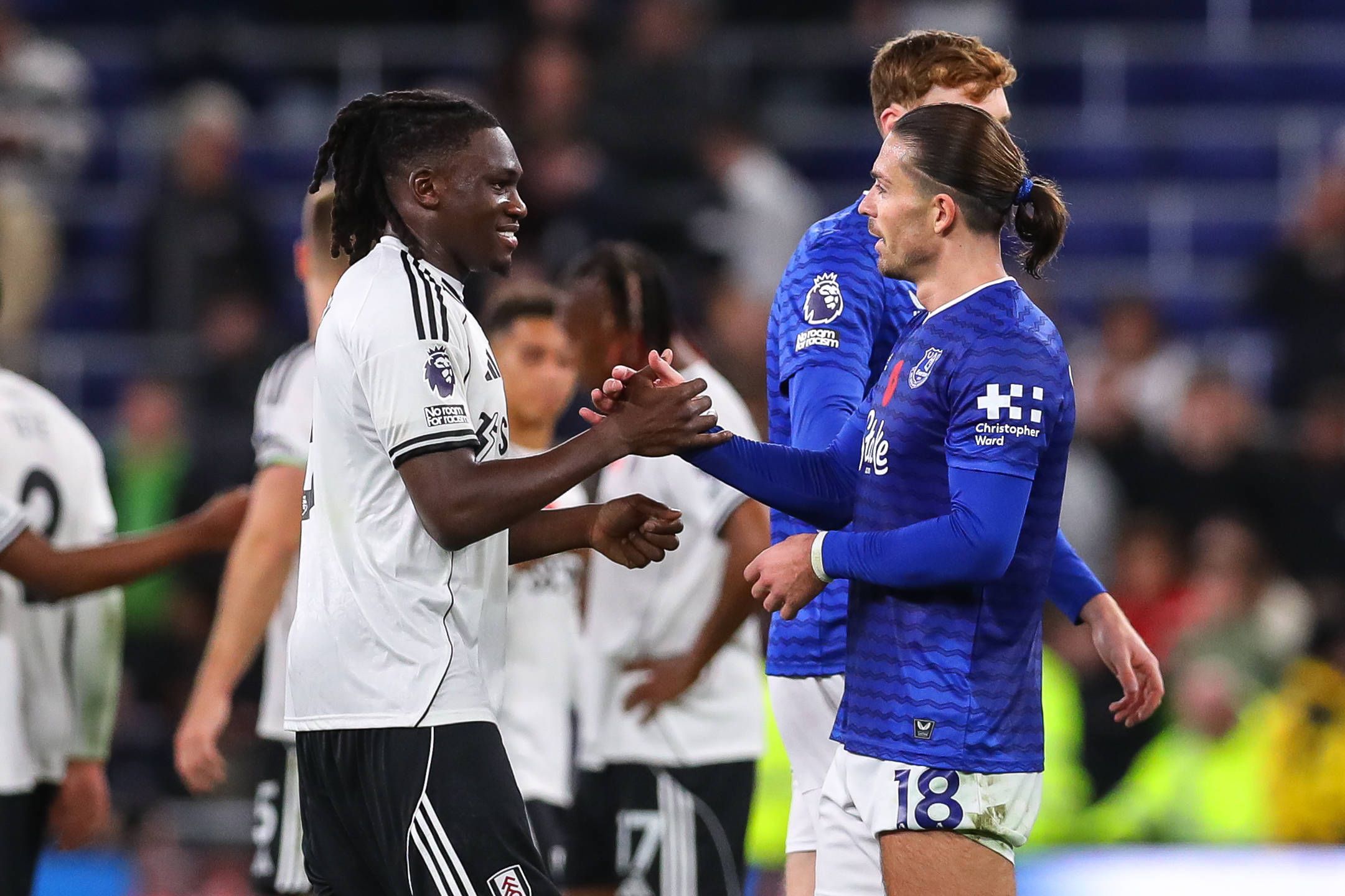 Calvin Bassey shakes hands with Jack Grealish after the Everton v Fulham Premier League match