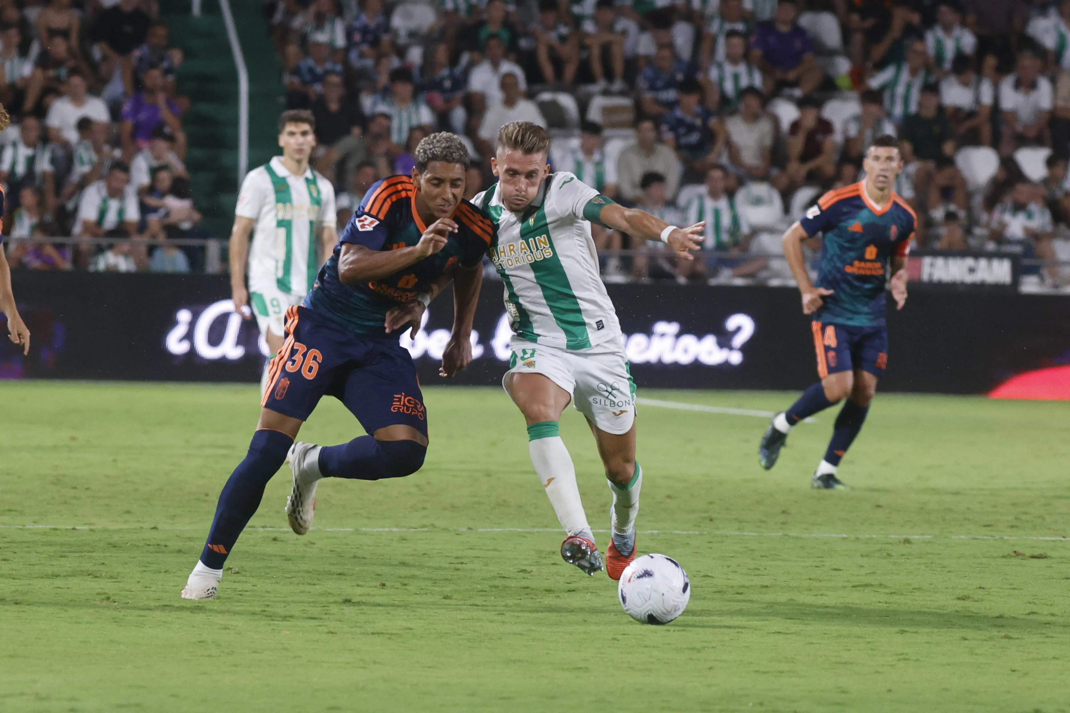 Owen Emeka of Granada battles for the ball.