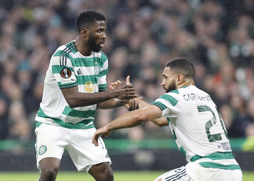 Kelechi Iheanacho helps Cameron Carter-Vickers to his feet during the UEFA Europa League match at Celtic Park